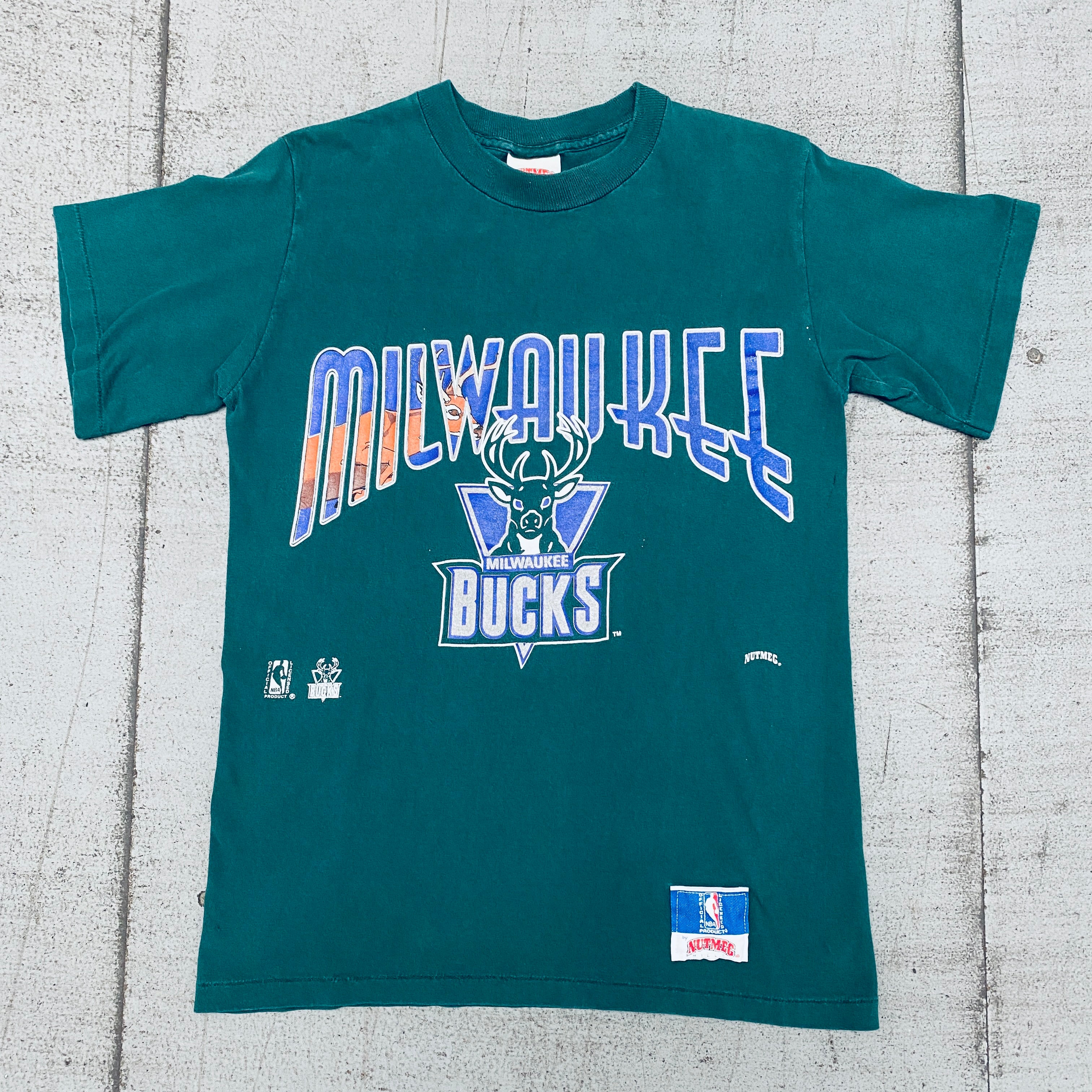 Milwaukee Bucks 1990s Vintage Graphic Spellout T-Shirt - Nutmeg Mills Retro NBA Basketball Tee for Men - Perfect for Game Day, Casual Wear & Fan Collections