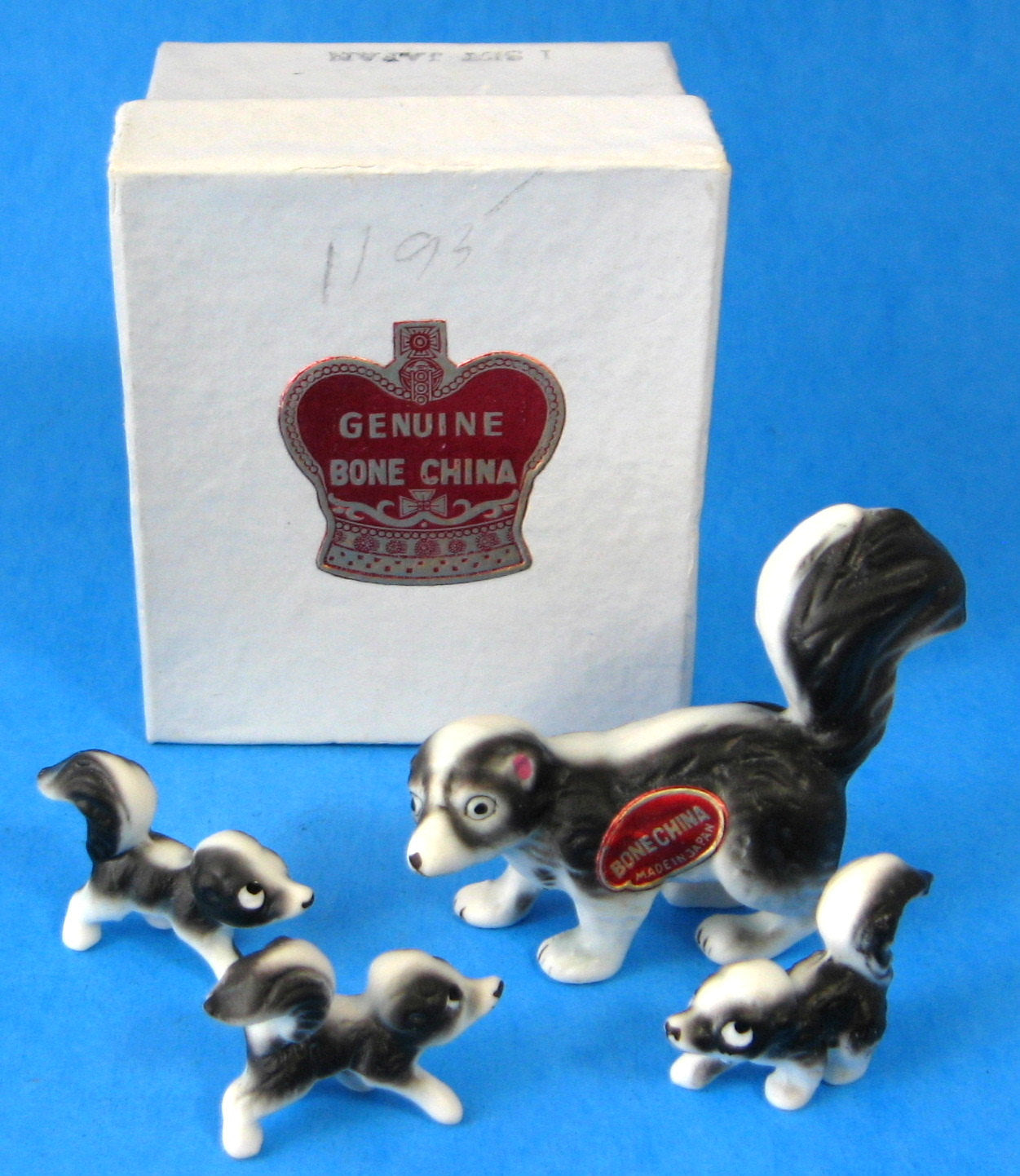 Skunk Family Figurines Set of 4 - Premium Bone China Collectibles with Original Box & Sticker (Made in Japan) - Perfect for Home Decor, Gift Giving, and Animal Lover Collections