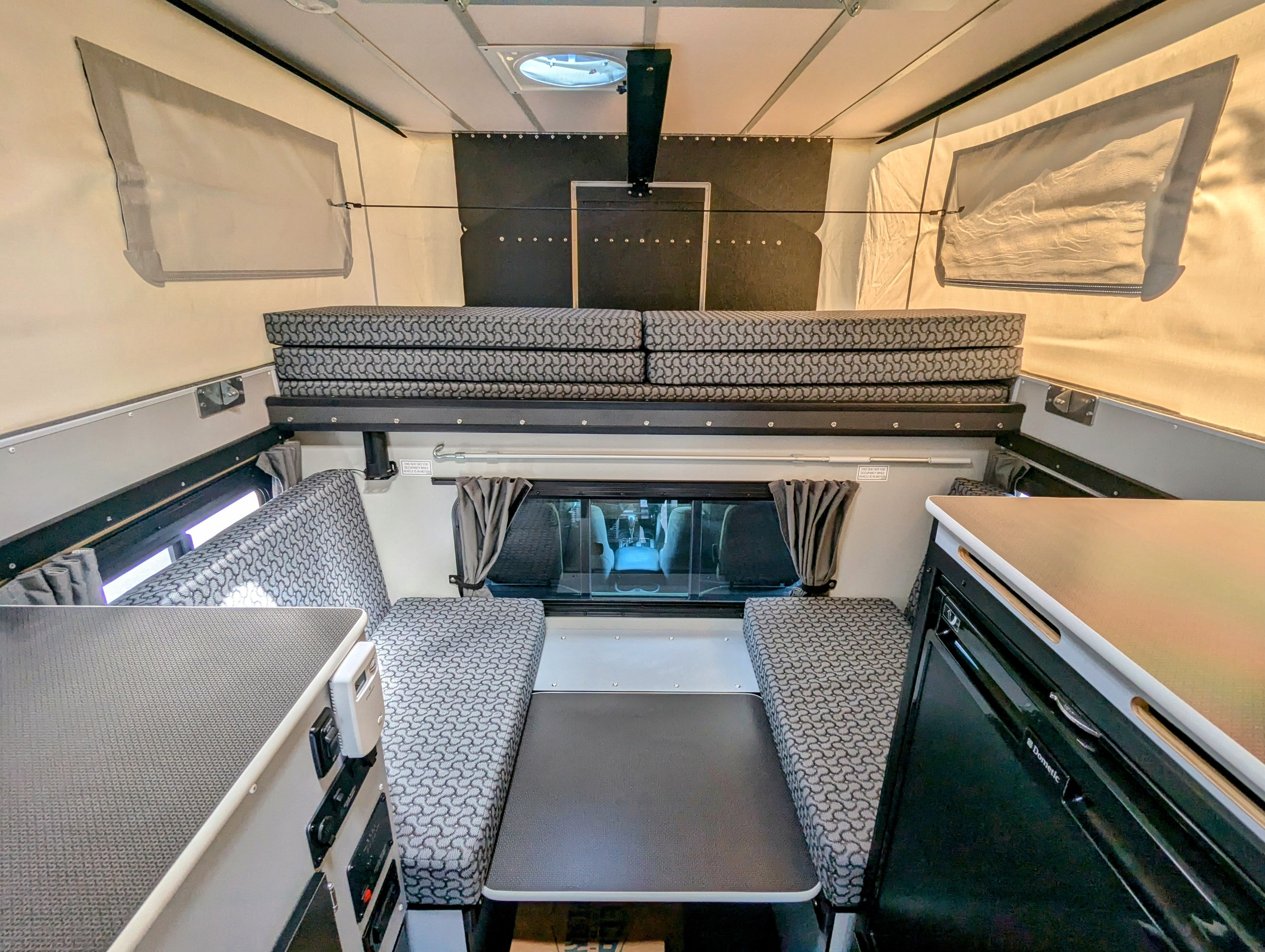 Used 2013 Fleet Four Wheel Camper with Front Dinette - Spacious RV for Family Road Trips & Outdoor Adventures