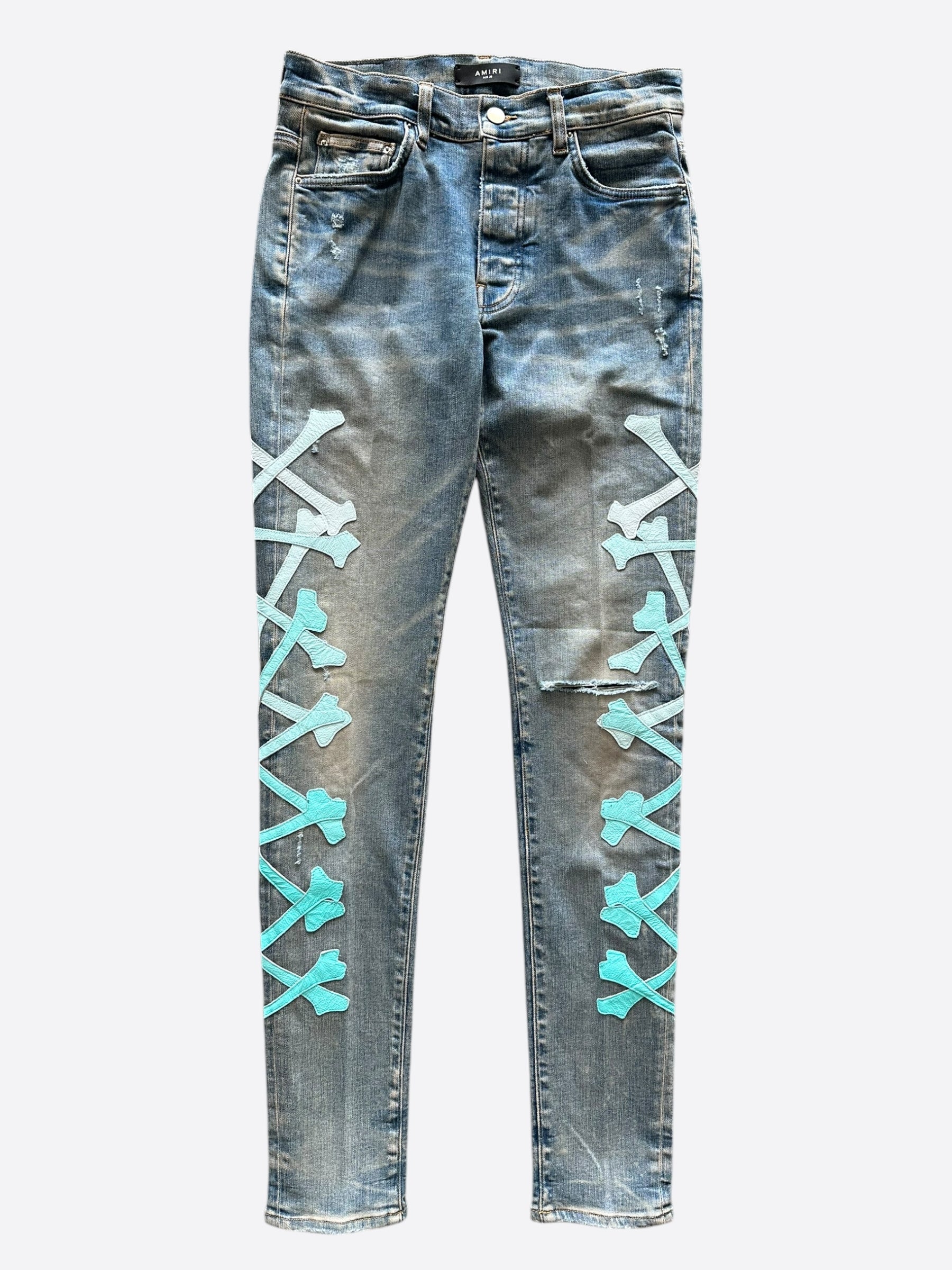 Amiri Blue & Turquoise Gradient Bones Applique Distressed Jeans for Men - Vintage Washed Denim Pants with Unique Embellishments, Perfect for Streetwear & Casual Outfits