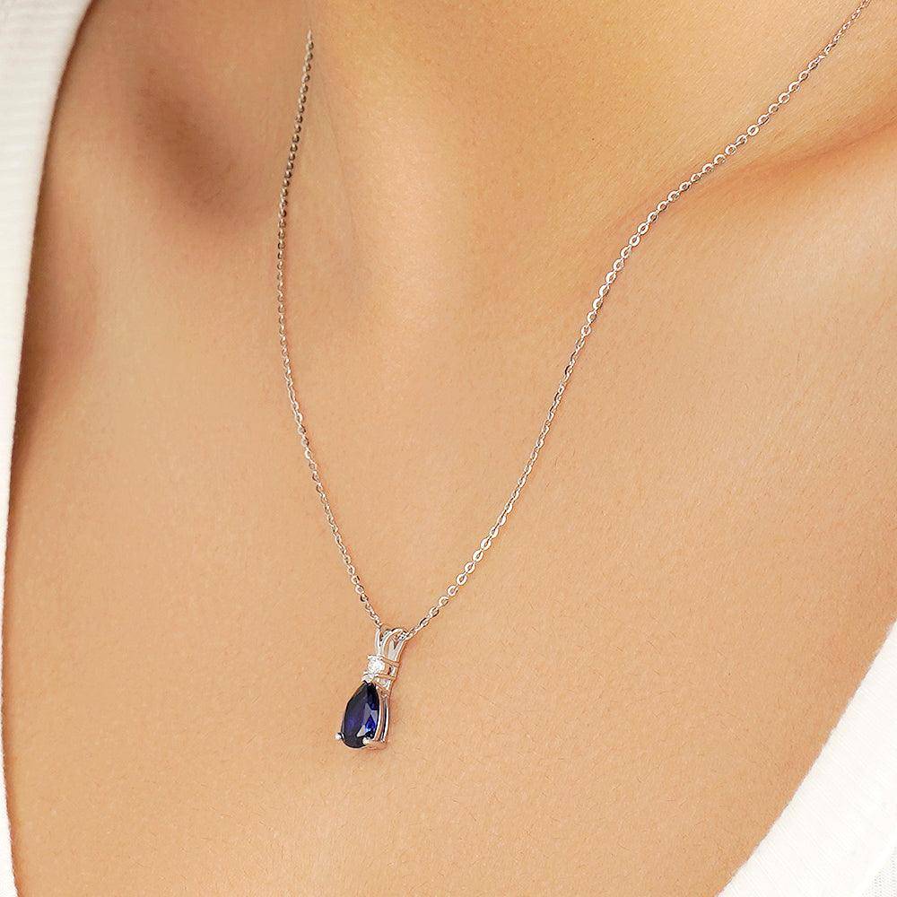 1.7 Carat Pear Cut Blue Sapphire Solitaire Pendant with White Sapphire Accents - Elegant Jewelry for Weddings, Anniversaries & Special Occasions