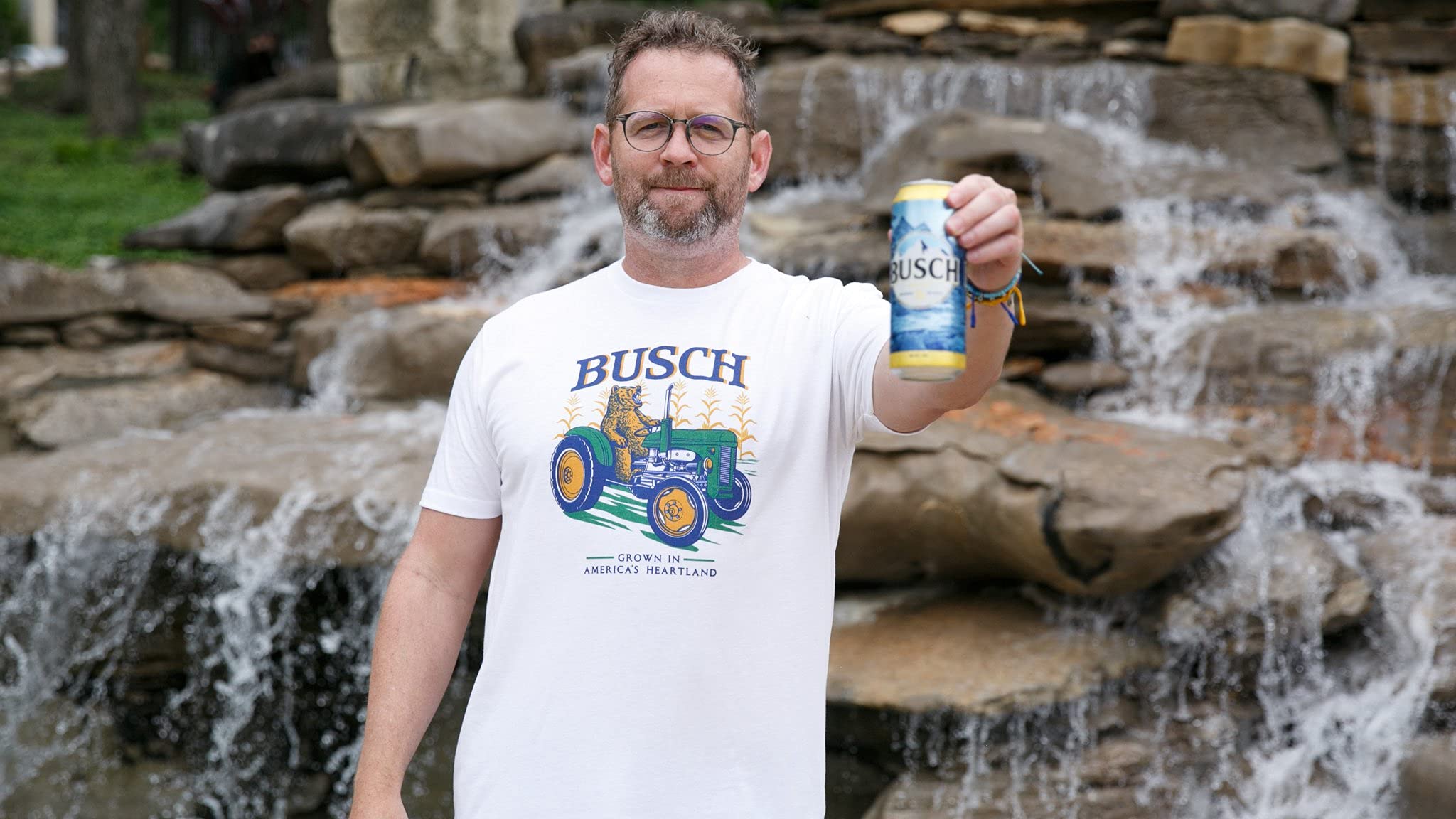 theCHIVE Busch America's Heartland Farming Tractor Beer T-Shirt | Vintage Farm & Beer Lover Graphic Tee | Perfect for Country Music Festivals & Casual Outings