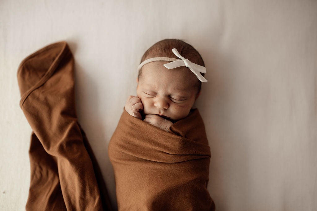 Snuggle Hunny Baby Jersey Wrap & Beanie Set - Soft Cotton Newborn Swaddle Blanket and Hat - Perfect for Hospital Photos, Baby Showers & Cozy Nursery Time (Bronze)
