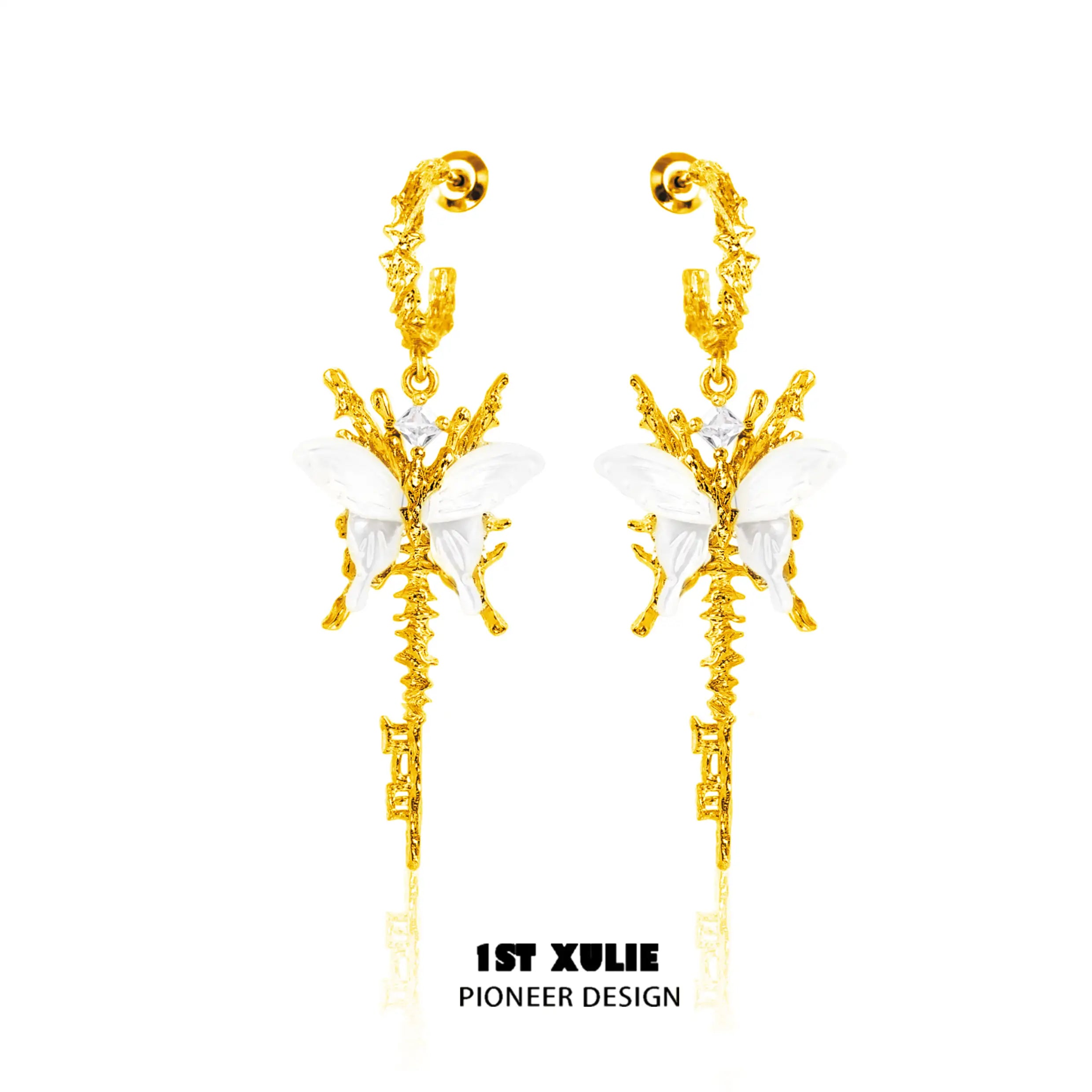 A pair of gold earrings