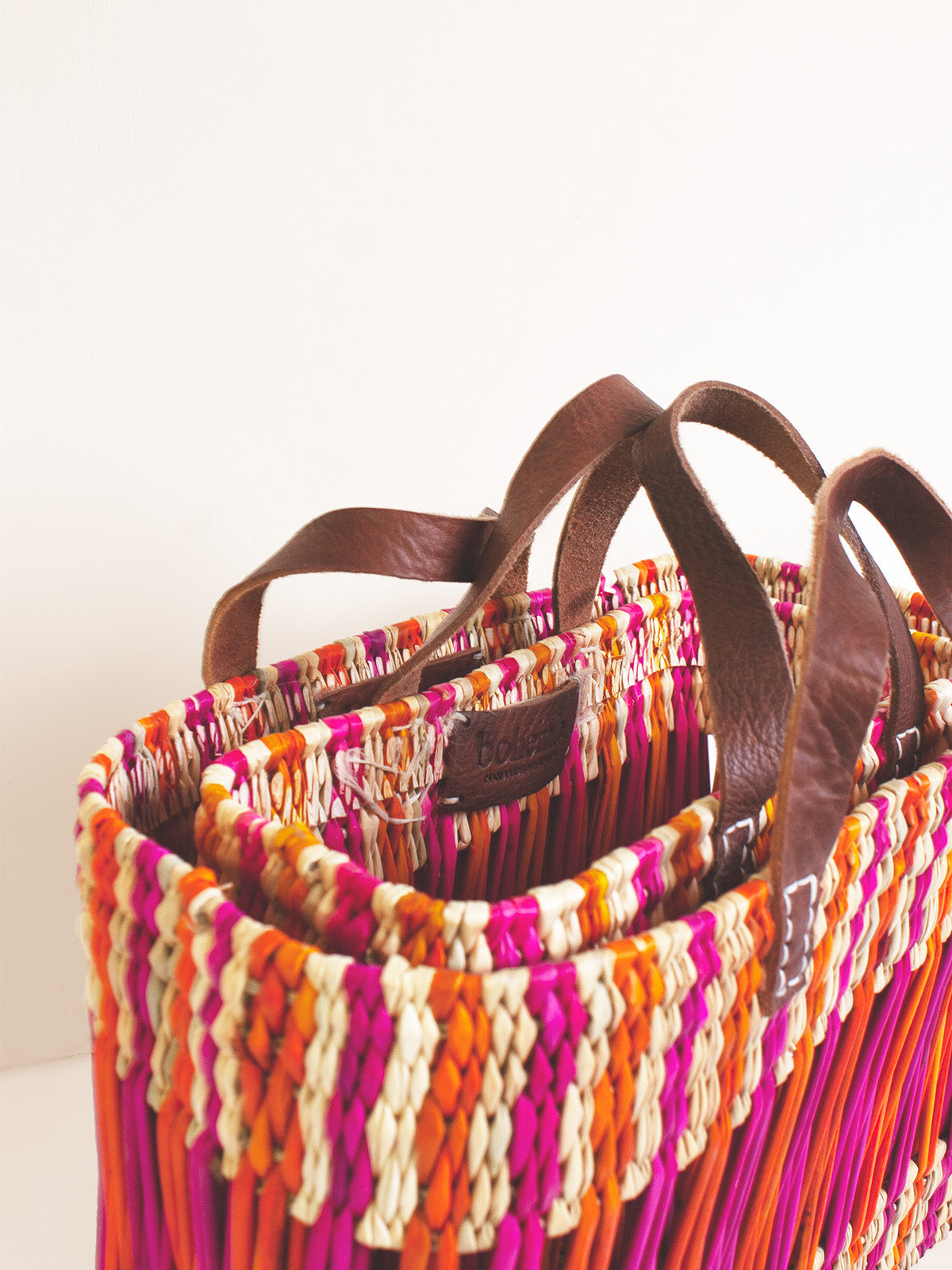 Decorative Reed Basket with Pink and Orange Stripes - Handwoven Storage Bin for Home Organization, Bathroom, Laundry, or Nursery Decor