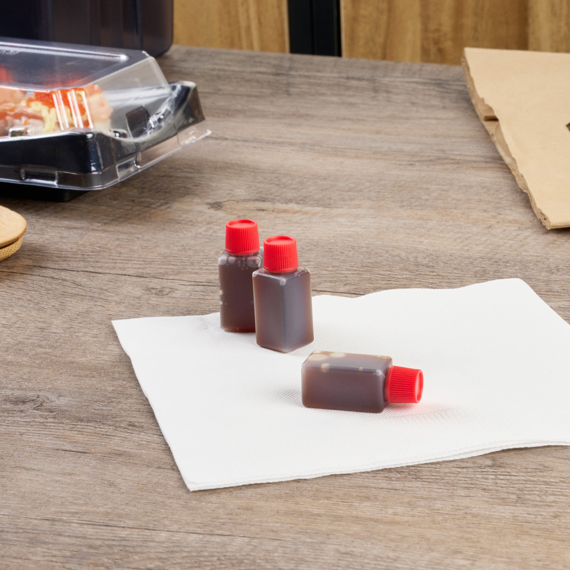 Bento Tek 6mL Clear Plastic Soy Sauce Bottles with Red Caps - 1/2