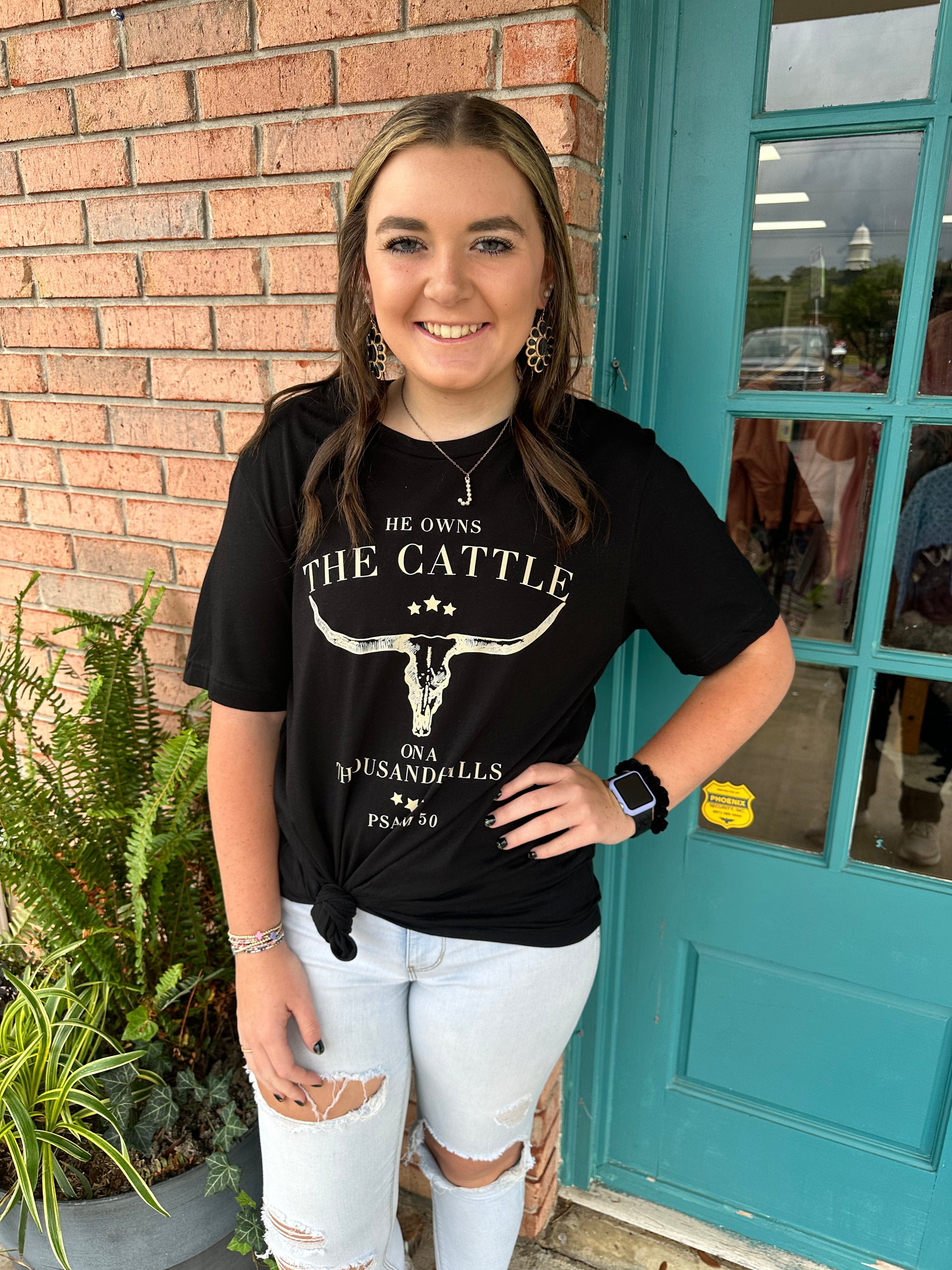 Men's 'He Owns the Cattle' Funny Cowboy Slogan Black T-Shirt - Perfect for Western Rodeo, Ranch Work & Country Music Festivals