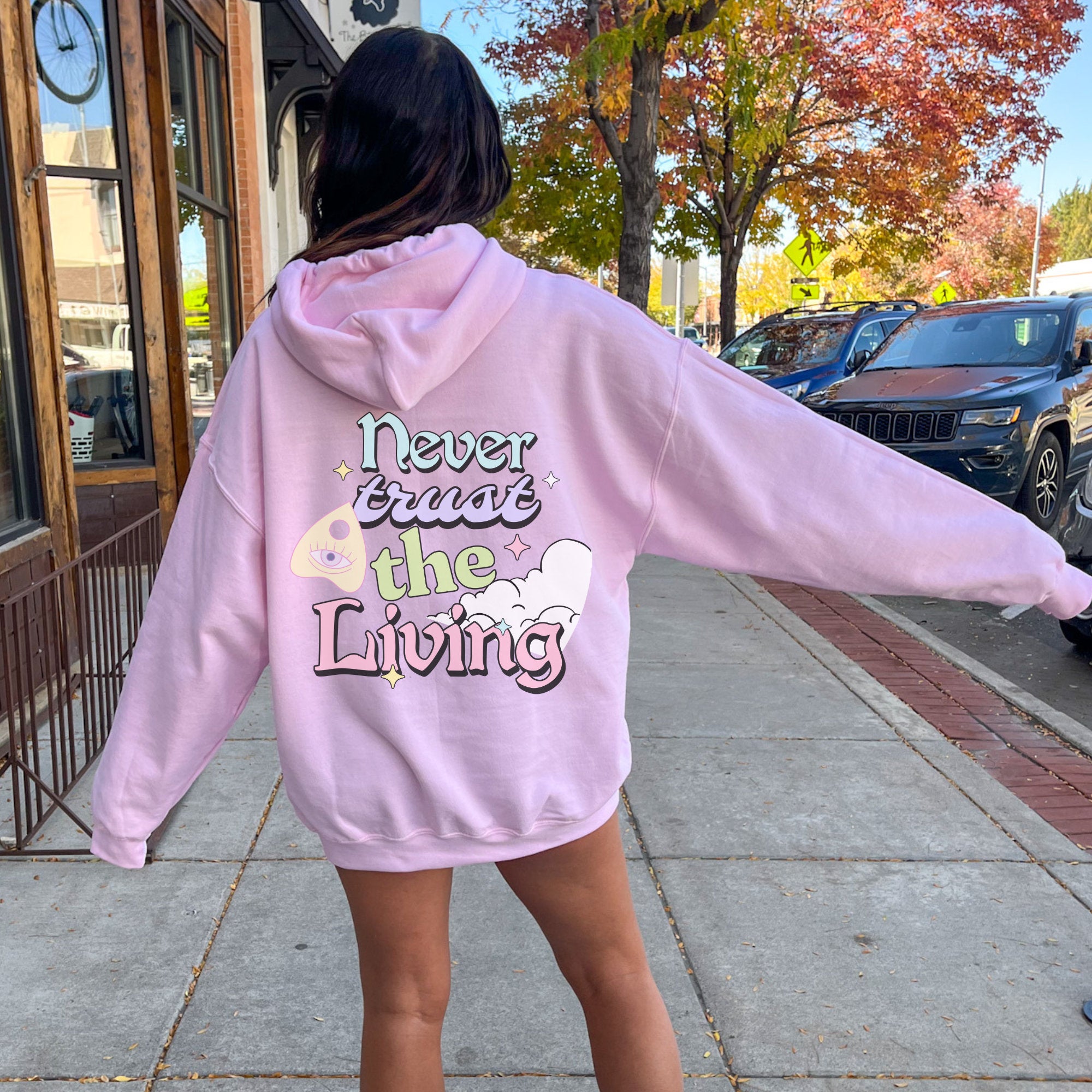 Never Trust the Living Lydia Deets Halloween T-Shirt | Pastel Halloween Costume Sweater Hoodie for Women & Men | Perfect for Halloween Parties, Cosplay & Gift Giving