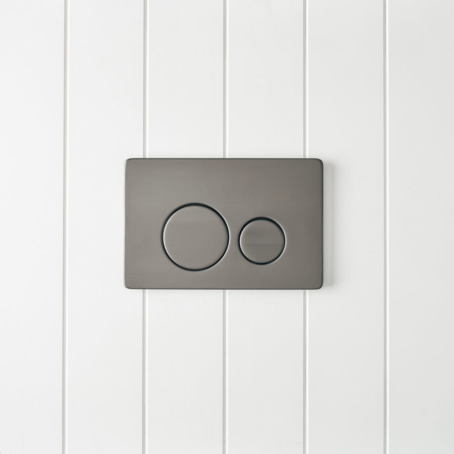 Angled In-Wall Toilet with Round Gunmetal Buttons - Modern Space-Saving Design for Small Bathrooms and Commercial Spaces