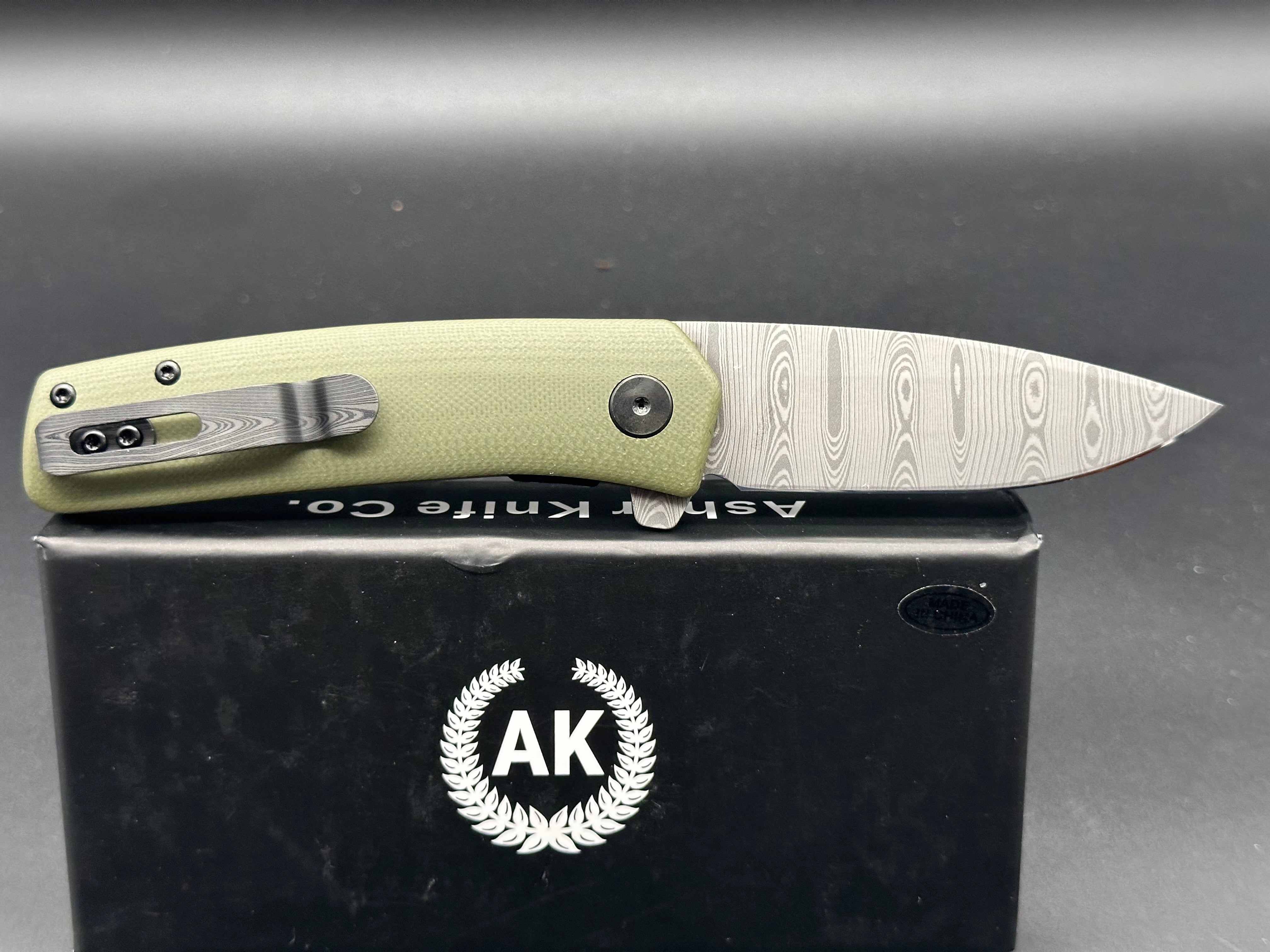Asher Knives The Spiro Flipper Folding Pocket Knife - OD Green G10 Handle, S35VN Steel Blade, Laser Ladder Damascus Pattern - EDC, Outdoor, Camping, Survival Gear