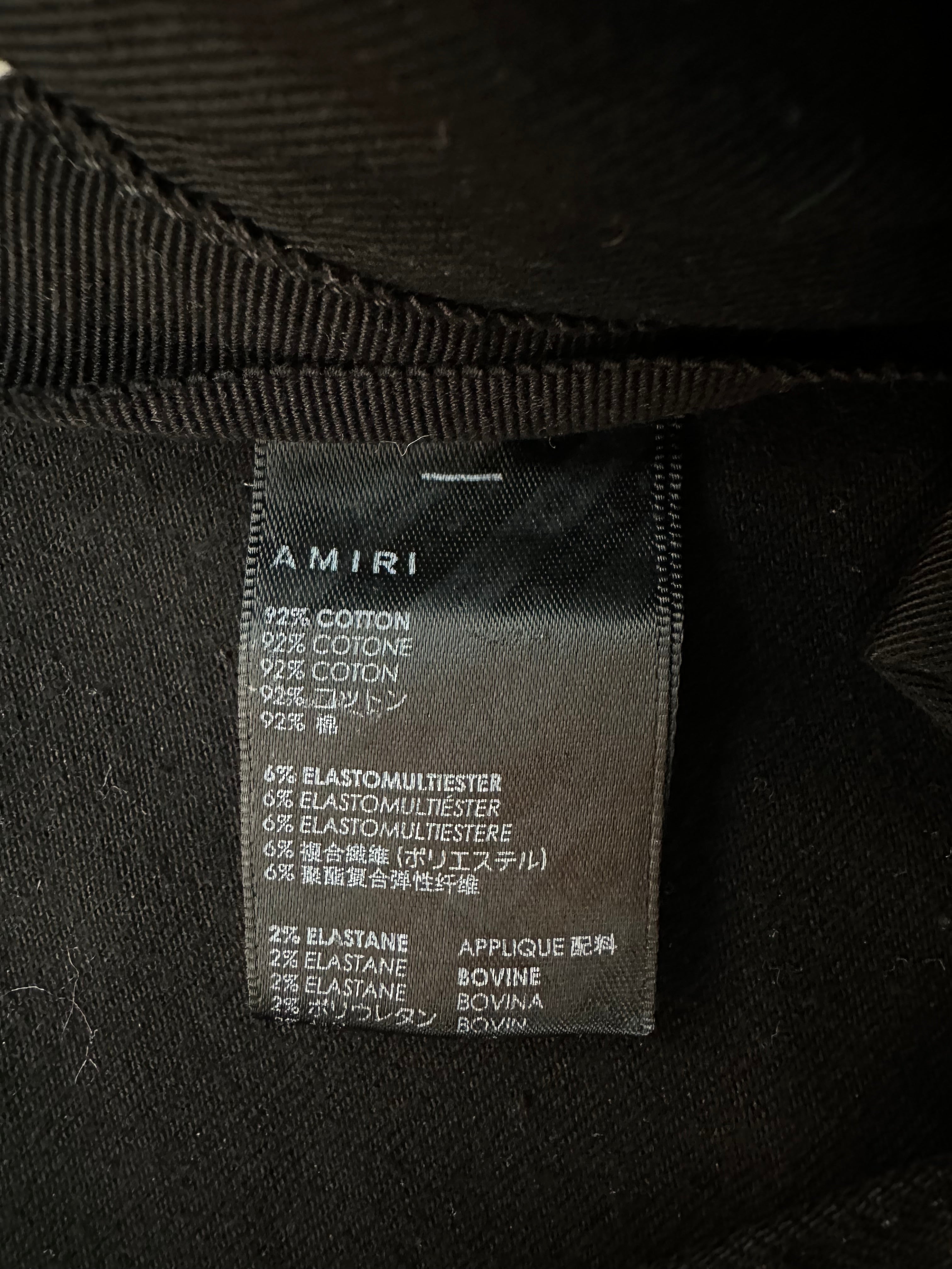 Amiri Black & Silver Bones Applique Distressed Jeans for Men - High Quality Designer Denim Pants | Perfect for Streetwear & Night Out Fashion