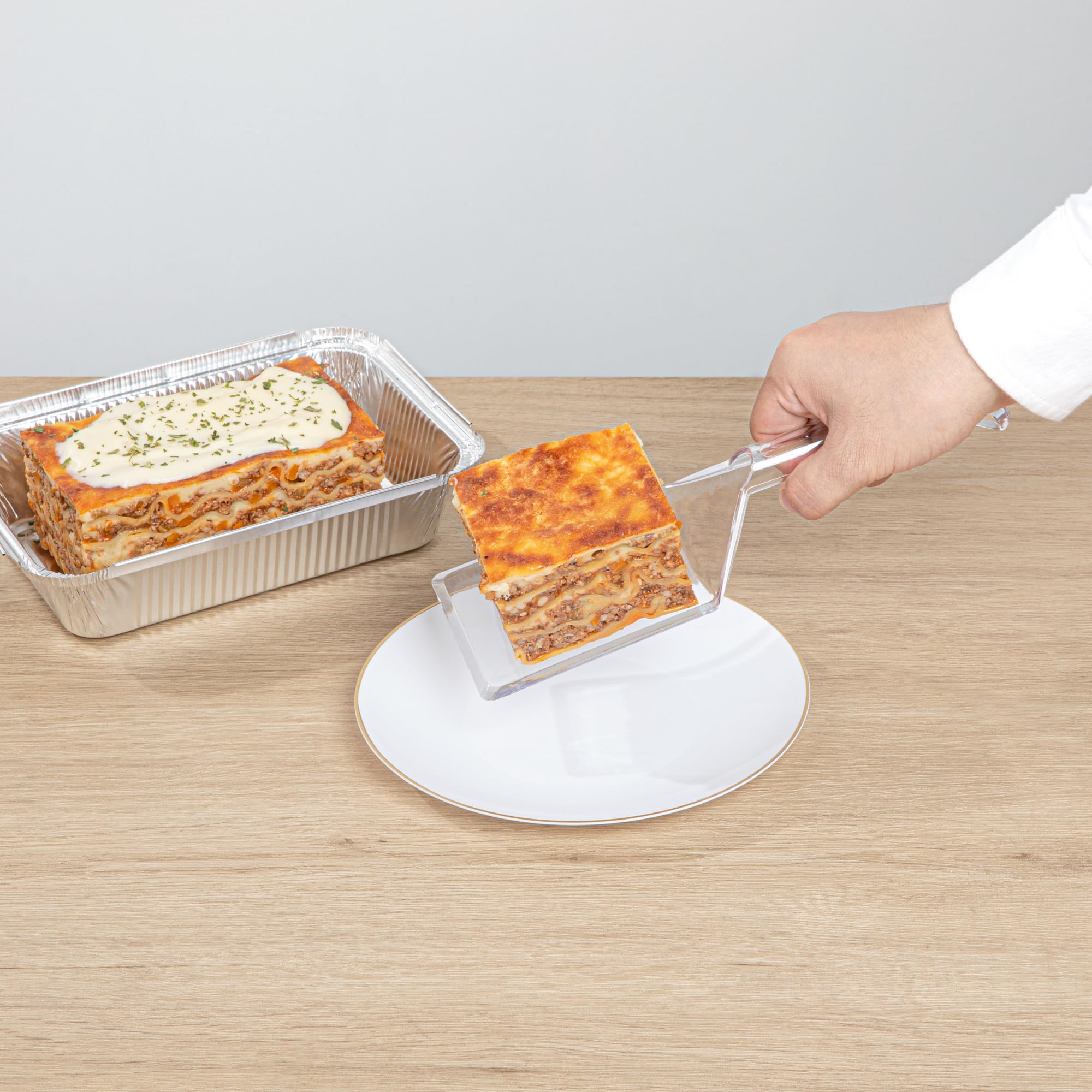 Restaurantware Cater Tek 10 Inch Disposable Serving Spatulas - 100 Pack Heavy-Duty Clear Plastic Lasagna Spatulas with Wide Edge & Comfortable Handle for Brownies, Cakes, Eggs - Perfect for Catering, Buffets, and Food Service