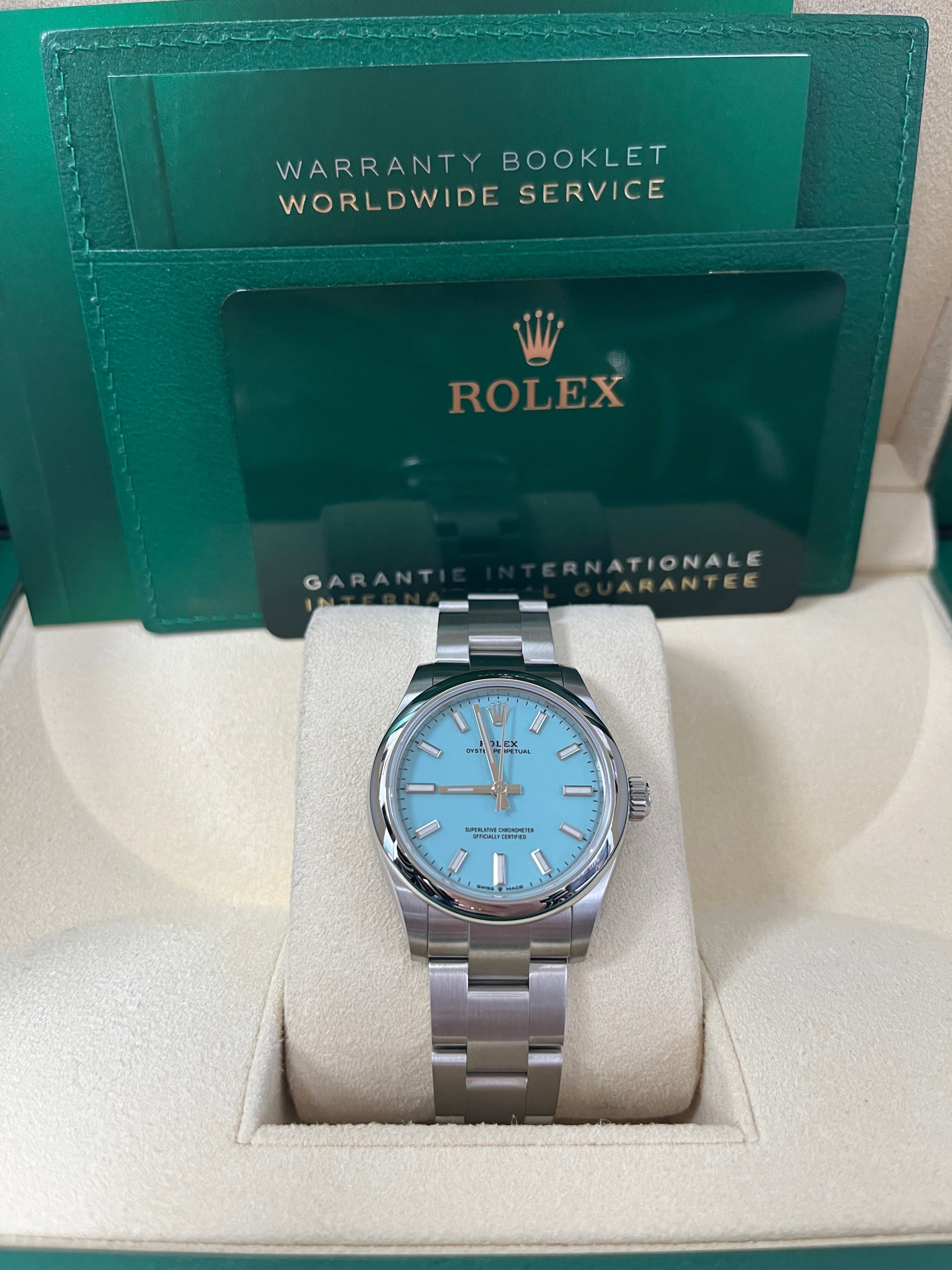 Rolex Oyster Perpetual 31mm Watch - Domed Bezel, Turquoise Blue Index Dial, Oyster Bracelet (Model 277200) | Luxury Women's Watch for Business, Parties & Special Occasions