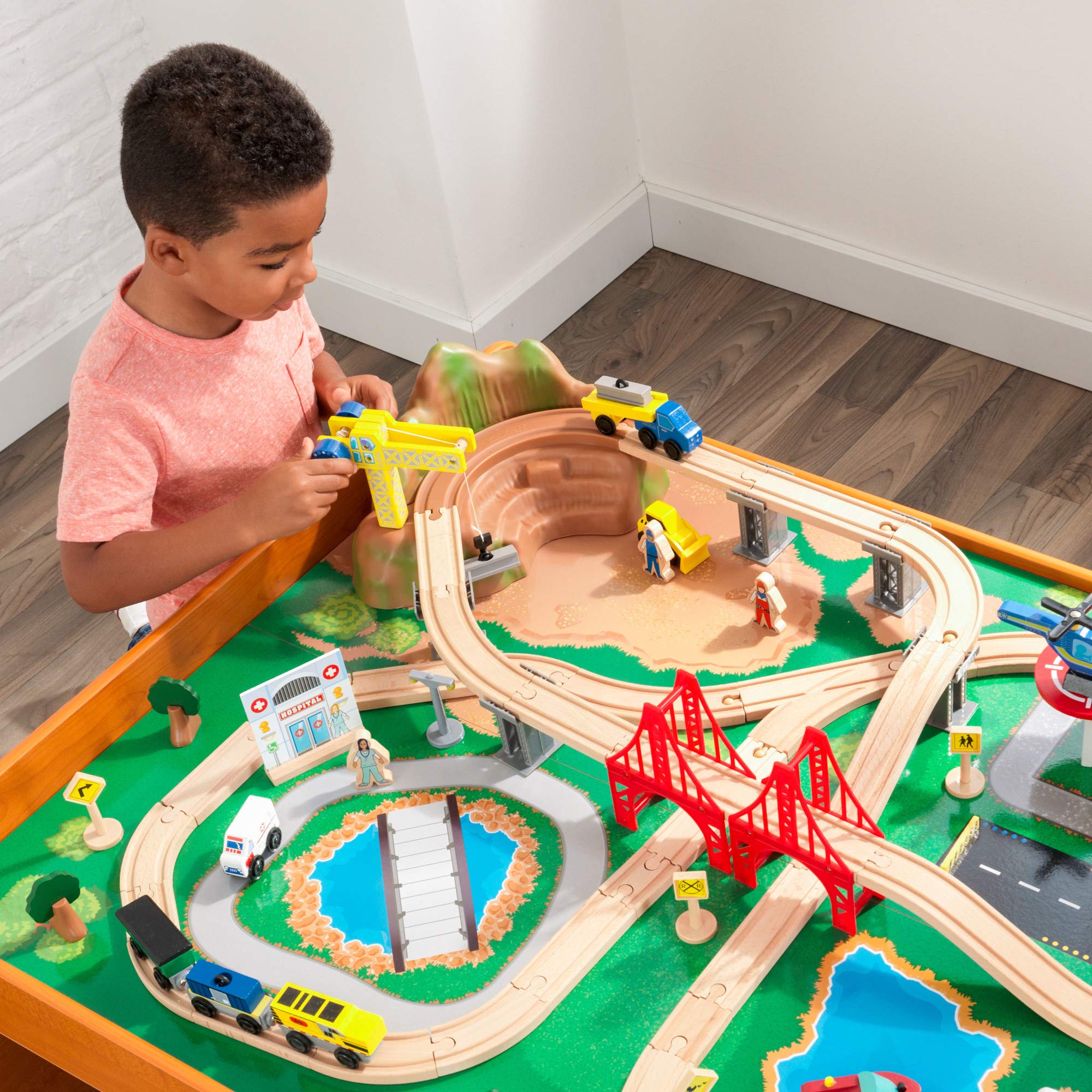 KidKraft Ride Around Town Wooden Train Set with Table - 100-Piece Playset Includes Helicopter, Airplane & Farm Accessories - Storage Bins & Major Brand Compatibility - Perfect for Preschool Playrooms & Toddler Birthday Gifts (Honey Finish)