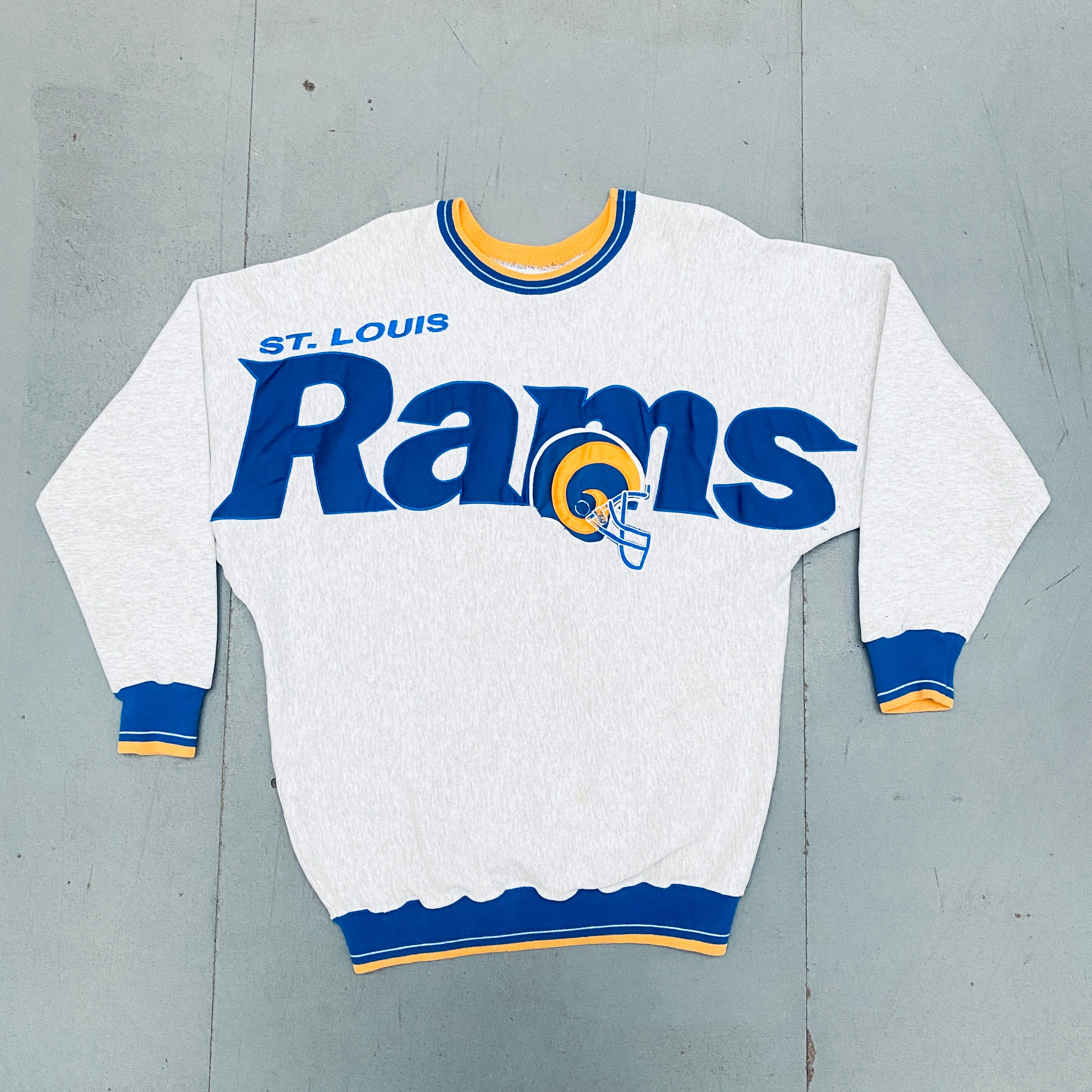Vintage 1990s St. Louis Rams Stitched Spellout Sweatshirt - Large Size | NFL Throwback Apparel for Football Fans & Retro Sportswear Collectors (Perfect for Game Day, Tailgating, and 90s Nostalgia Fashion)