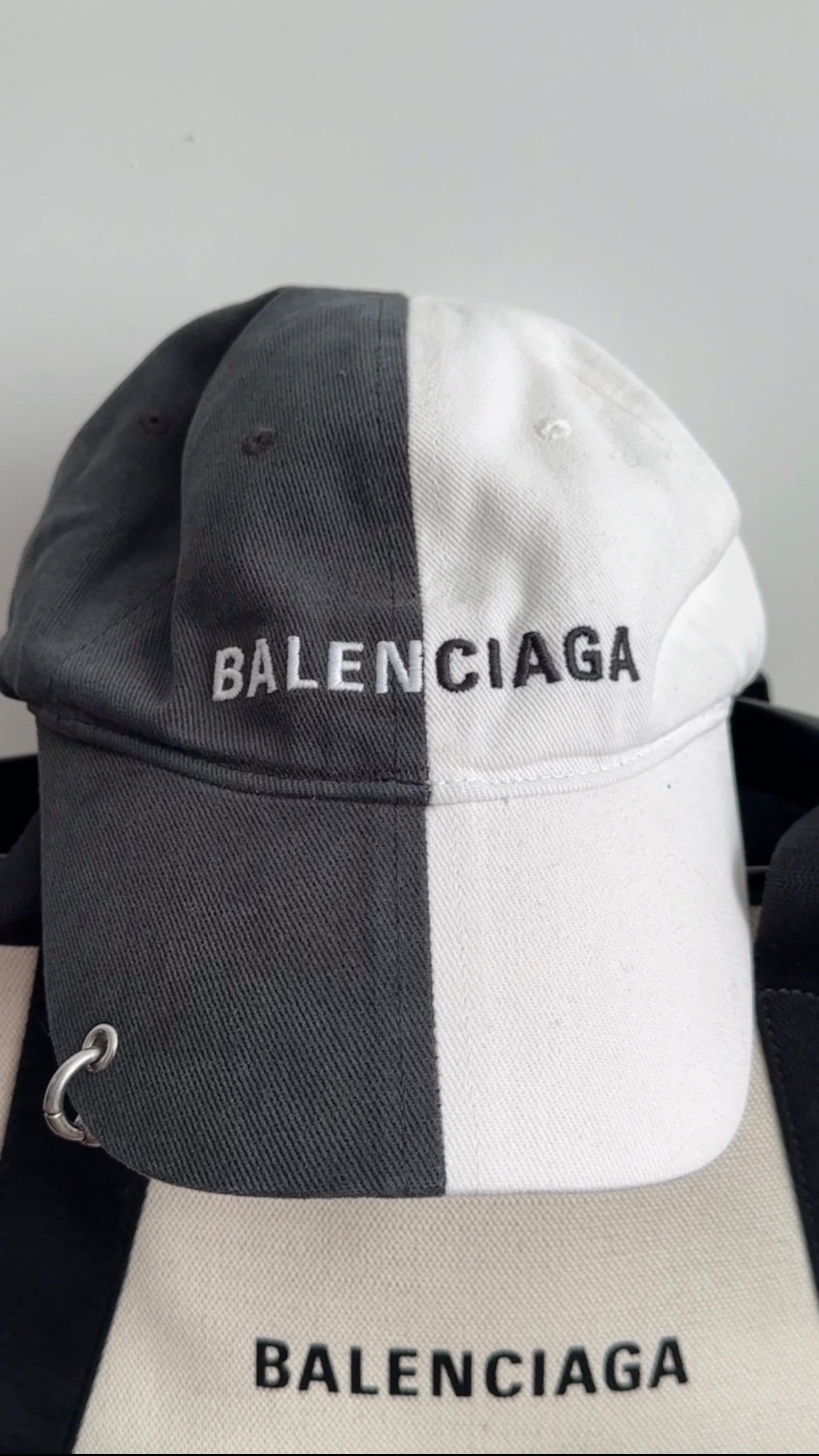 Balenciaga Dark Grey & White 50/50 Logo Piercing Hat - Unisex Baseball Cap for Streetwear Fashion & Urban Lifestyle