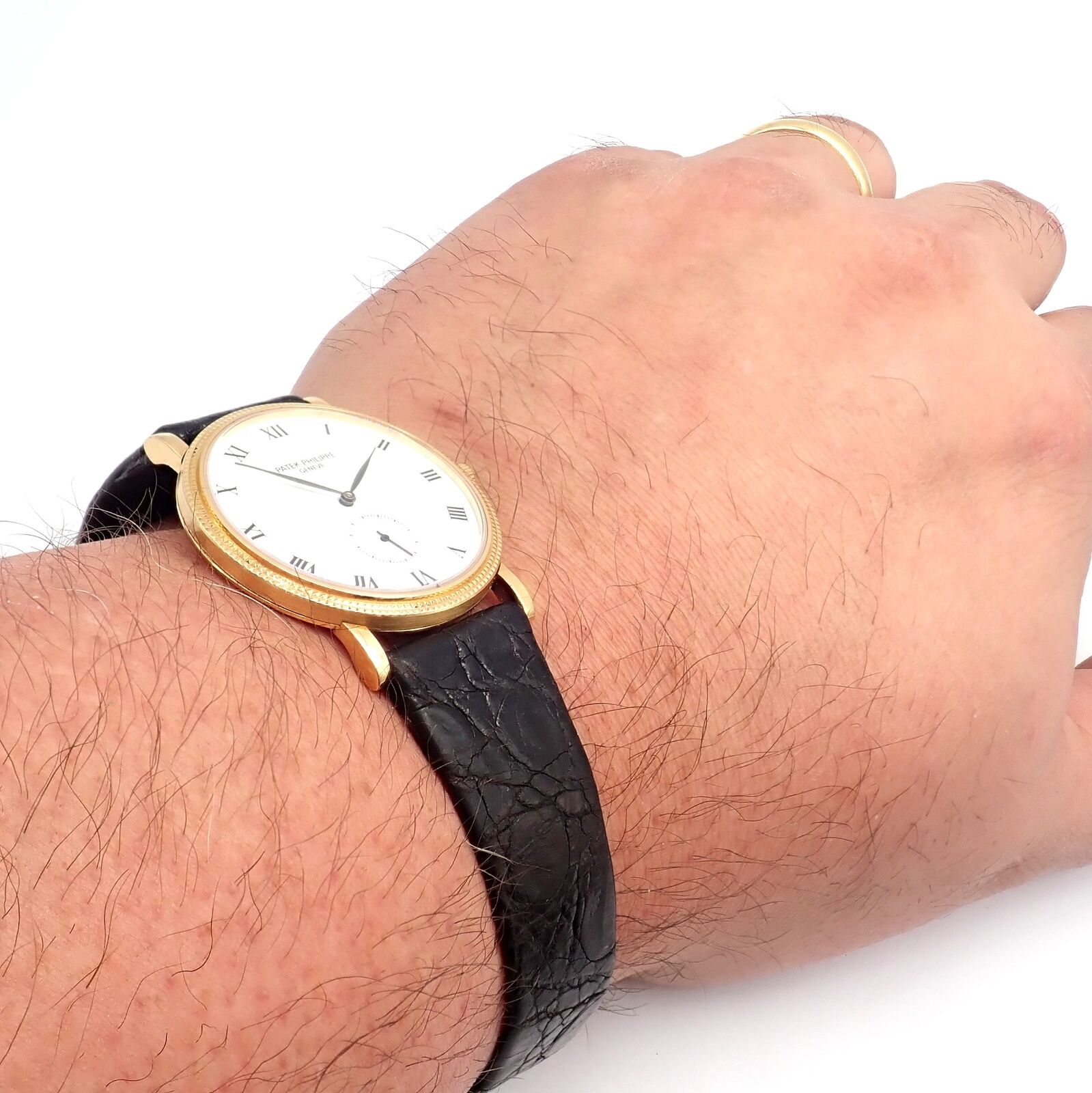Patek Philippe Calatrava 18k Yellow Gold Men's Watch with Roman Dial - Manual Wind Luxury Dress Watch for Formal Events & Business Occasions