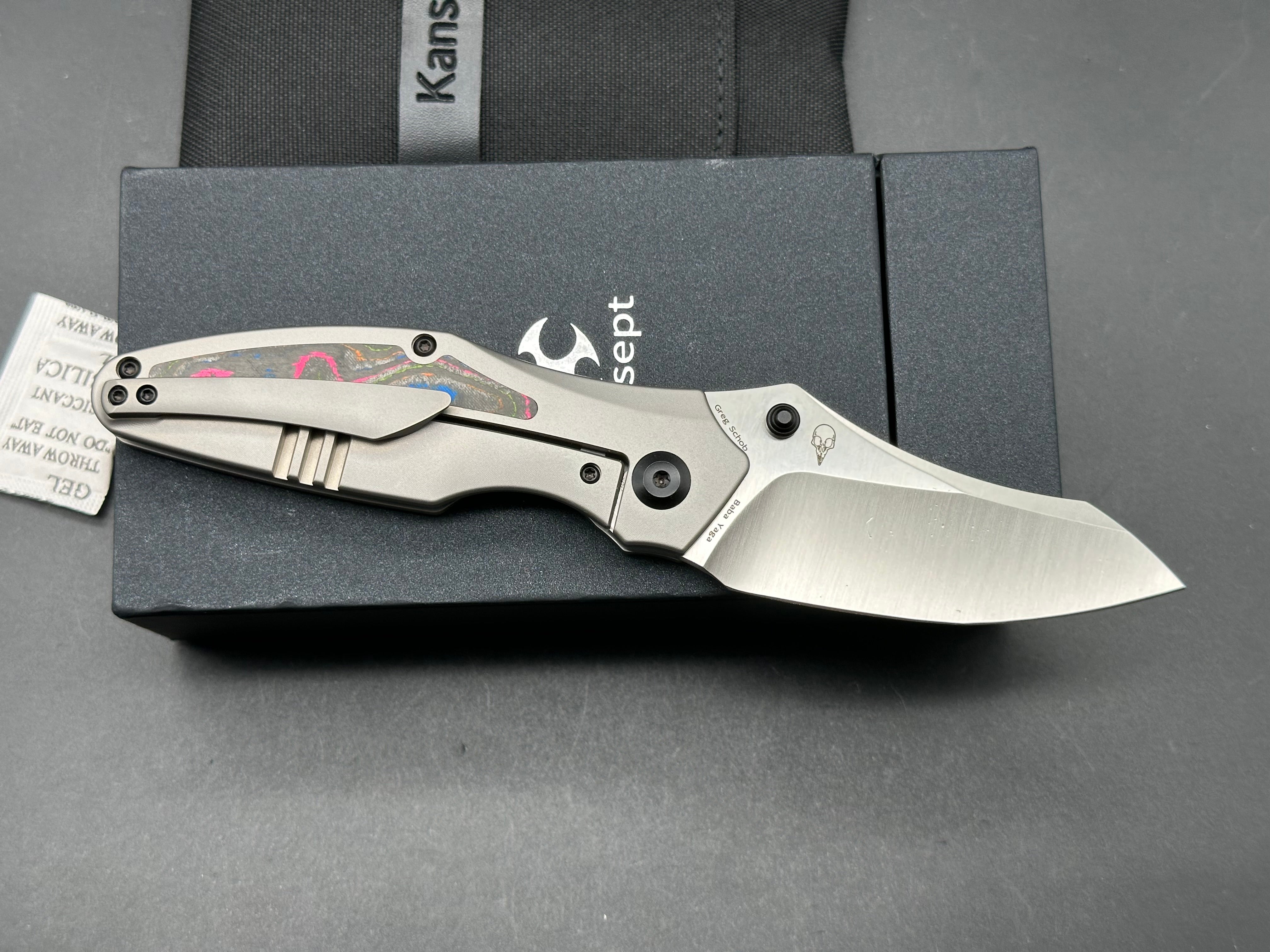 KANSEPT BABA YAGA Folding Pocket Knife - Titanium Handle with 80s Camo Carbon Fiber Inlay, 20CV Steel Plain Edge Blade - EDC, Camping, Outdoor Survival Gear