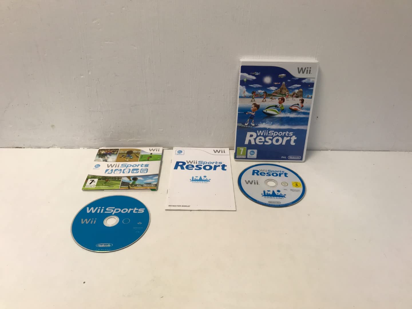 Nintendo Wii Console Bundle with Wii Sports & Wii Sports Resort Games - Includes Motion Plus Controller - Perfect for Family Fun & Multiplayer Gaming