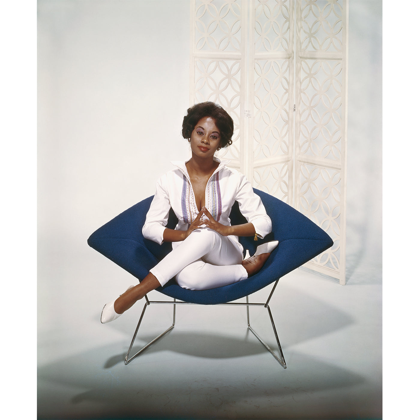 Stylish Young Woman Sitting on Modern Armchair - High-Quality Stock Photo for Websites, Blogs & Social Media