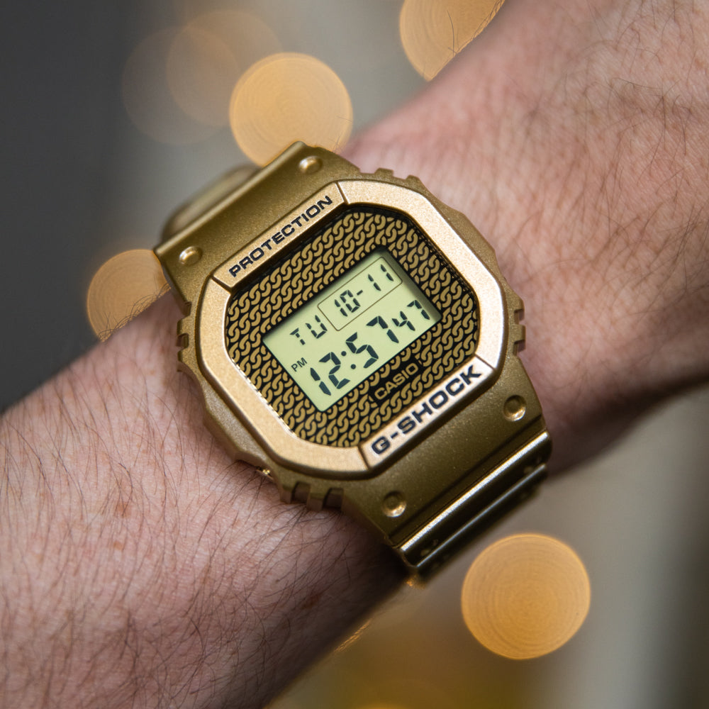 G Shock DWE5600HG 1D Gold Chain Digital Watch with Interchangeable Cases - Stylish Unisex Timepiece for Outdoor Sports & Everyday Wear