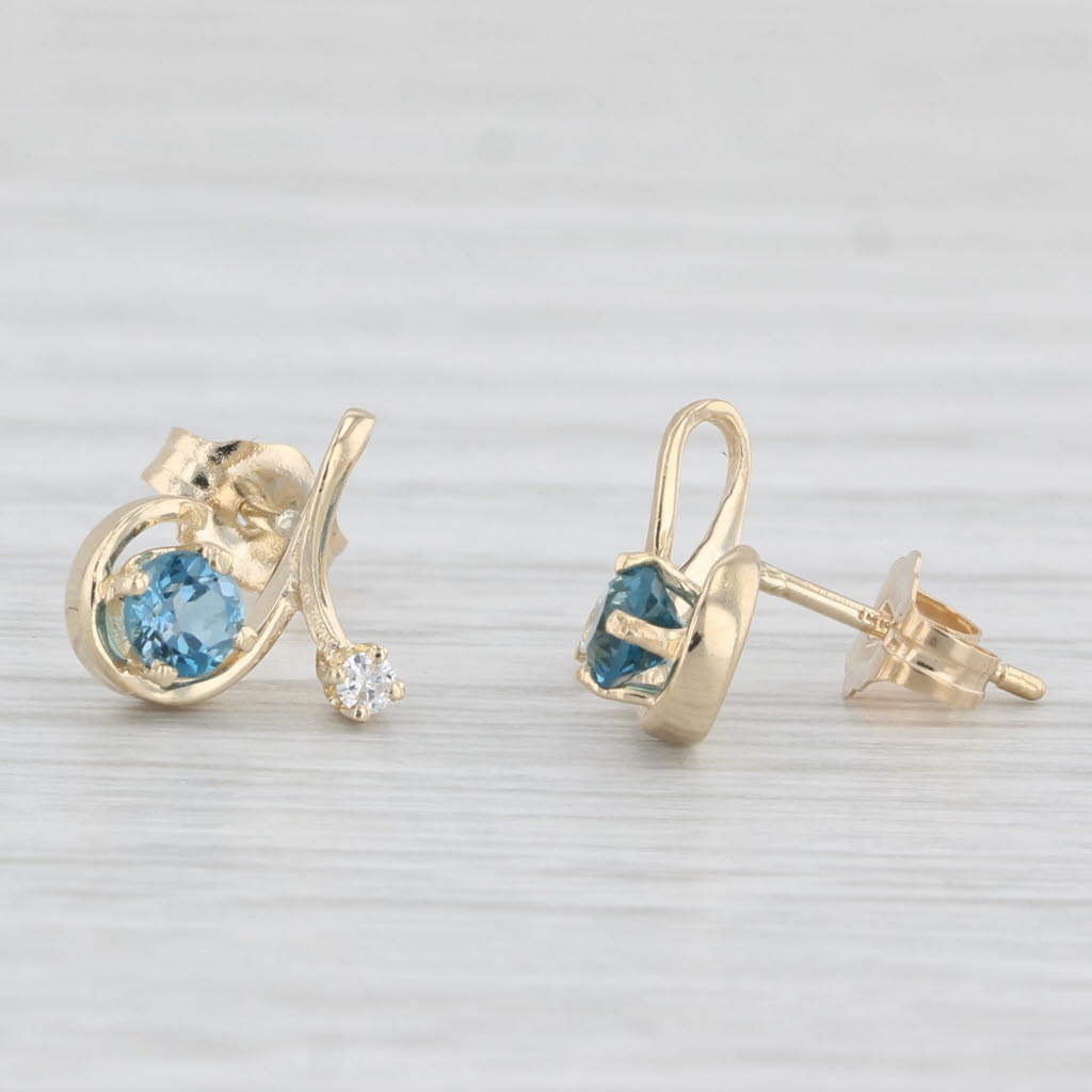 0.48ctw Blue Topaz & Diamond Swirl Stud Earrings in 14k Yellow Gold - Elegant Jewelry for Women, Perfect for Weddings, Parties & Special Occasions