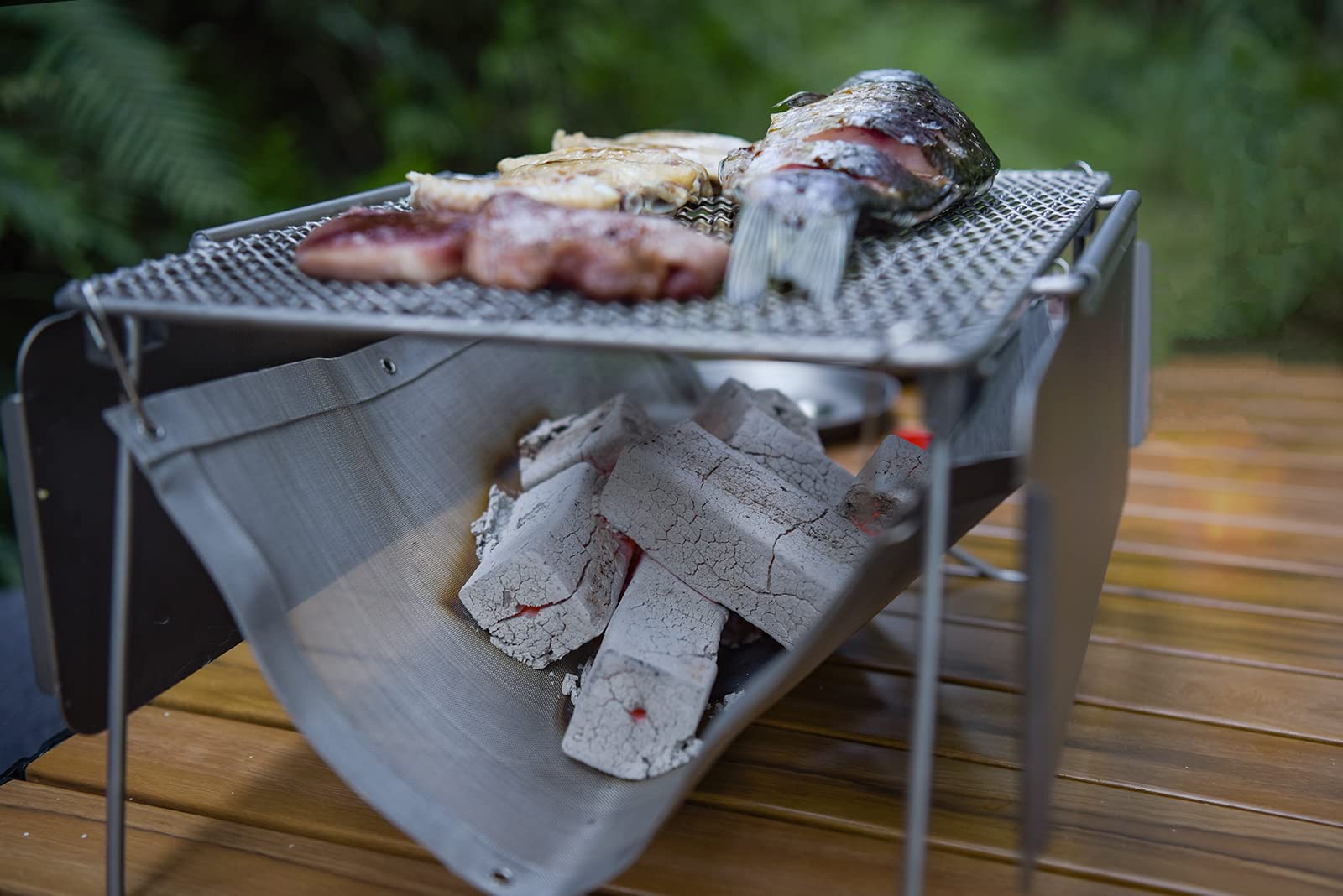 Boundless Voyage Titanium Folding Campfire Grill - Portable 2-in-1 BBQ Charcoal Grill & Camping Table with Collapsible Legs & Frying Plate - Perfect for Outdoor Picnics, Backpacking, and Camping Adventures