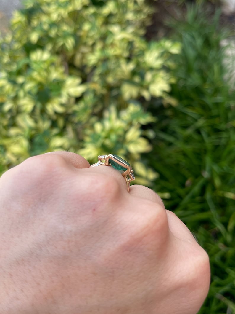 4.35tcw 14K Gold Lush Green Emerald Cut Half Bezel East-West Diamond Engagement Ring with Round Brilliant Side Stones | Perfect for Proposals, Anniversaries & Special Occasions