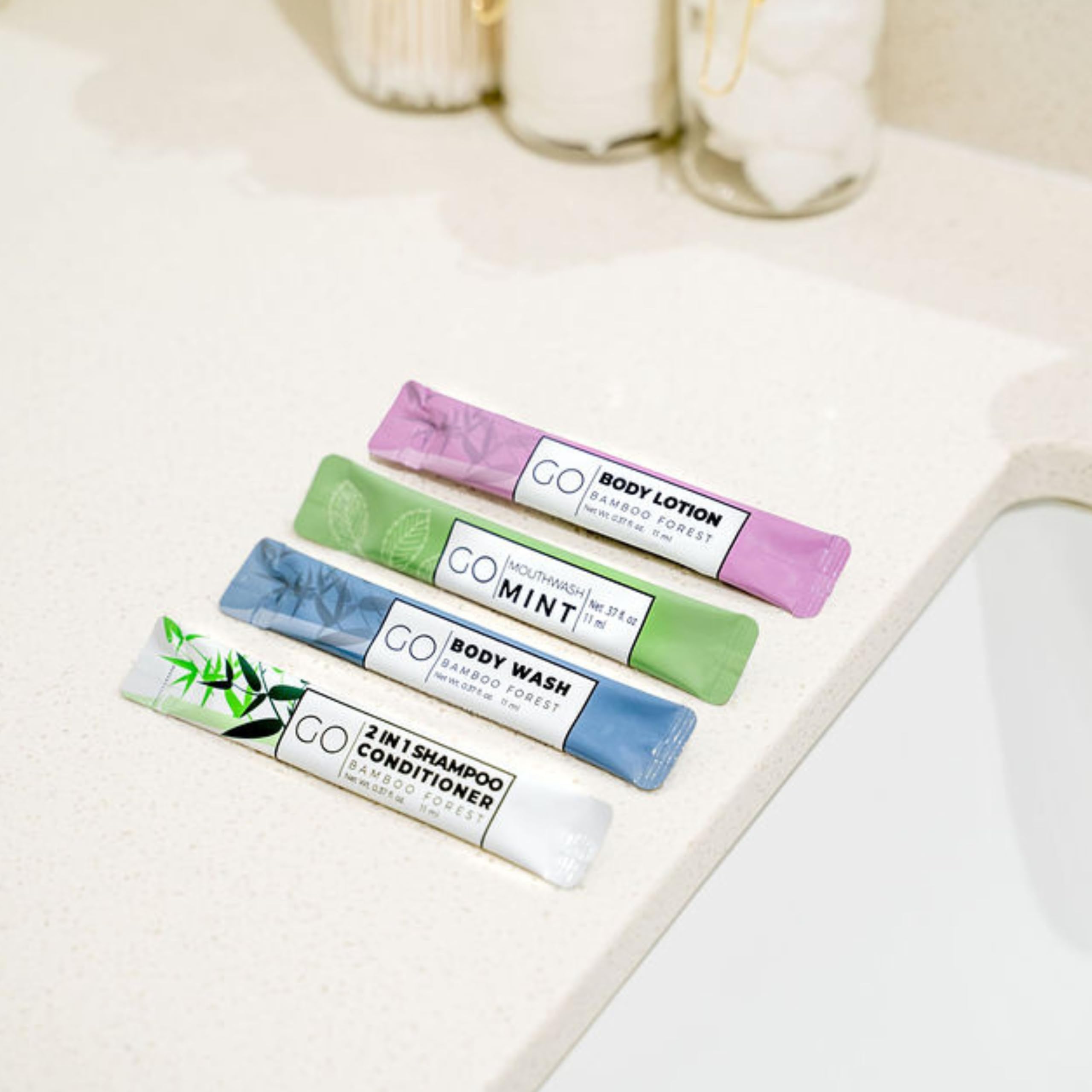 GO Essentials - Travel Size Toiletries Kit for Men & Women | Shampoo, Conditioner, Body Wash, Lotion & Mouthwash Set | Perfect for Hotels, Air Travel & Guest Bathroom Supplies