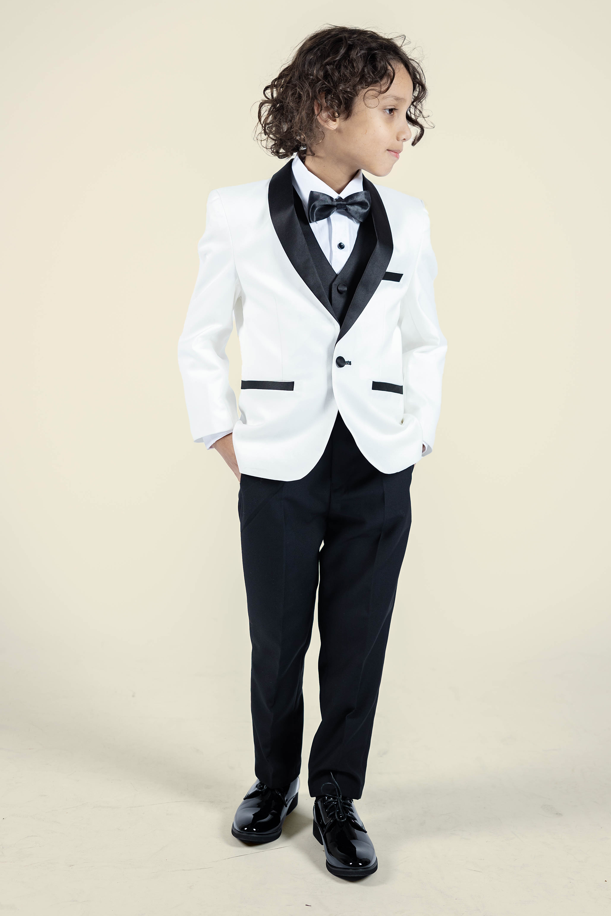 Stylish Boys Off-White Tuxedo with Black Lapel & Matching Black Pants - Perfect for Weddings, Prom, and Formal Events