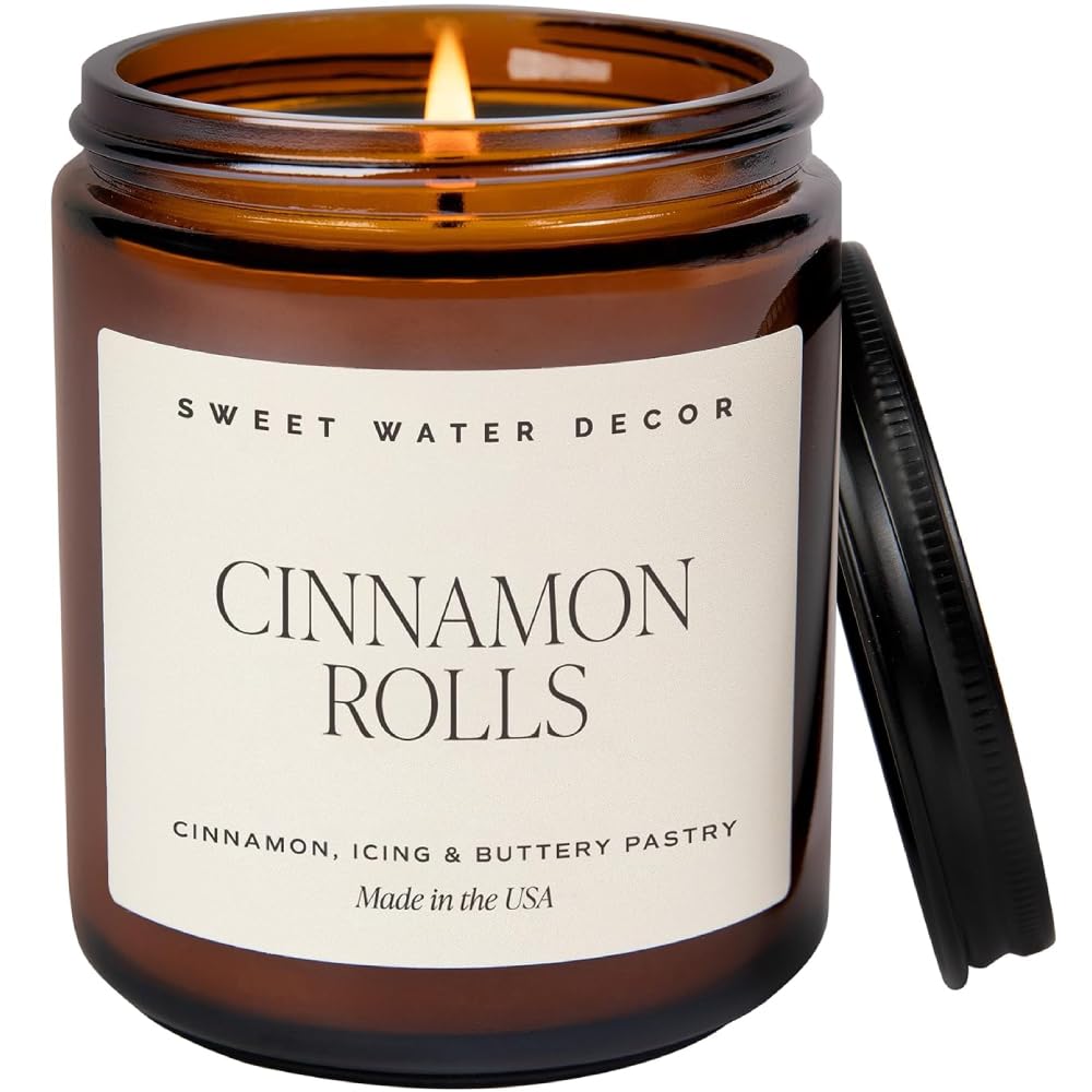 Sweet Water Decor Cinnamon Roll Scented Soy Candle - Christmas Holiday Home Fragrance with Cinnamon, Icing & Buttery Pastry Notes - 40 Hours Burn Time in 9Oz Amber Jar with Black Lid - Perfect for Cozy Winter Nights, Holiday Decor & Gift Giving