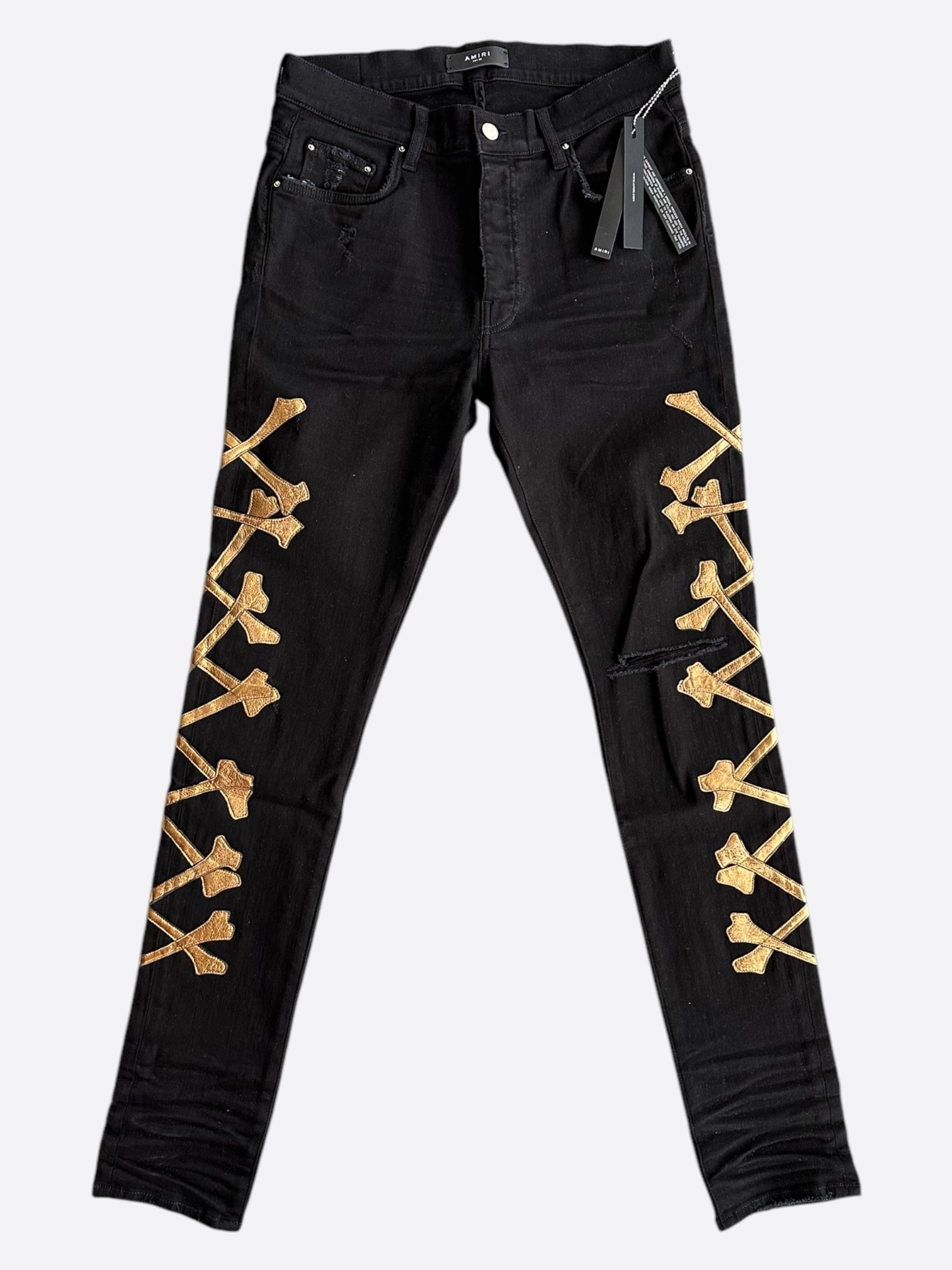 Amiri Black & Gold Bones Applique Distressed Jeans for Men - High Quality Designer Denim Pants | Perfect for Streetwear & Night Out Fashion