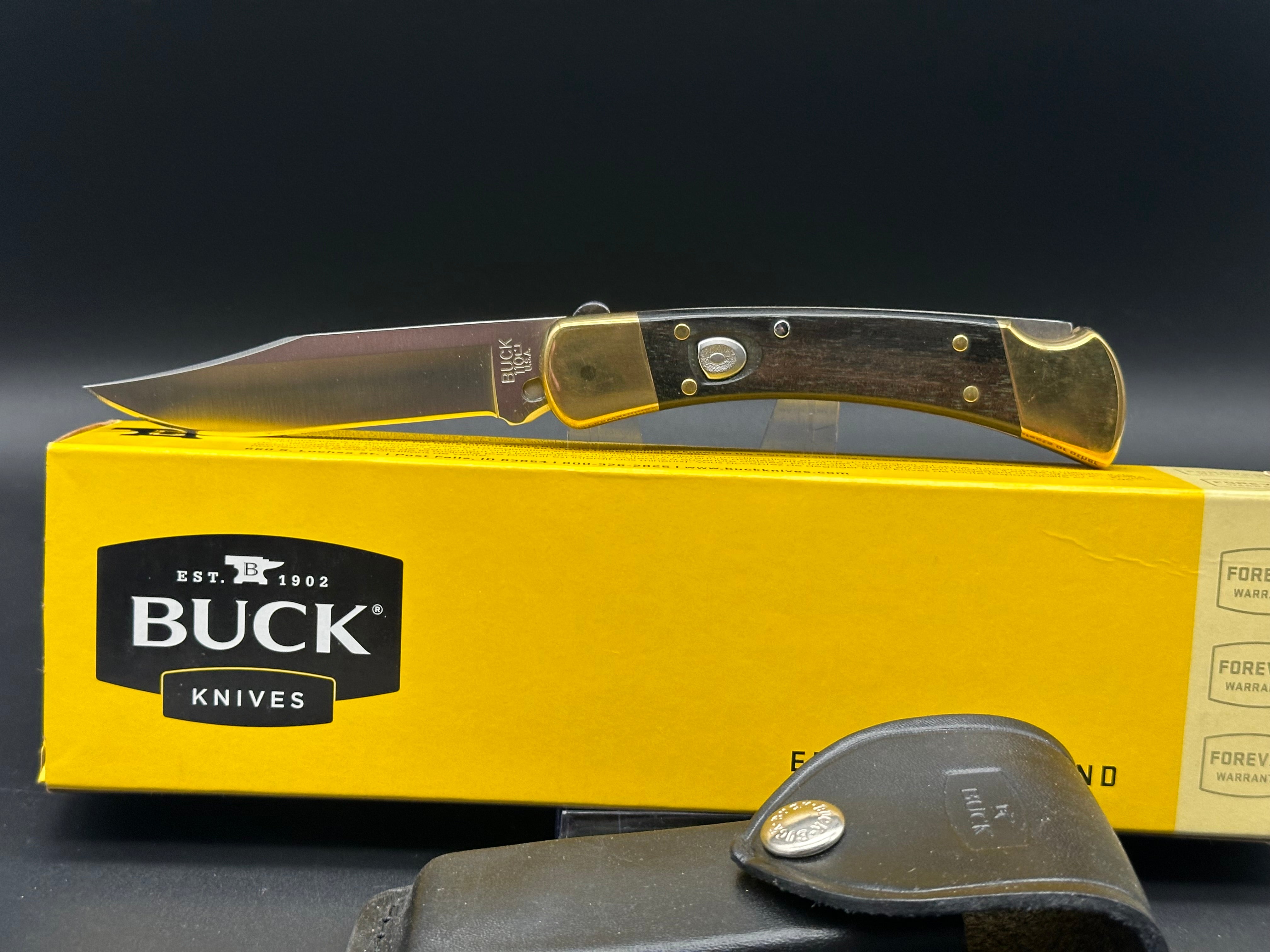 Buck 110 Automatic Folding Knife - Ebony Wood & Brass Handle, 420HC Stainless Steel Blade with Leather Sheath - Perfect for Hunting, Camping & Everyday Carry (EDC)