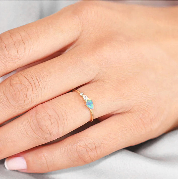 White Fire Opal Pear Three Stone Ring - Elegant Sterling Silver Jewelry for Women | Perfect for Weddings, Anniversaries & Special Occasions
