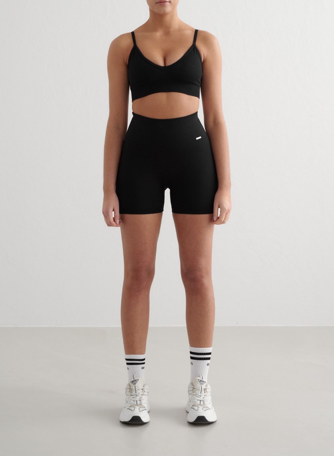 Black Ribbed Seamless Midi Biker Shorts & Deep Cut Sports Bra Set - High Waist Yoga Shorts & Workout Bra for Women, Perfect for Gym, Running, Cycling and Lounge Wear