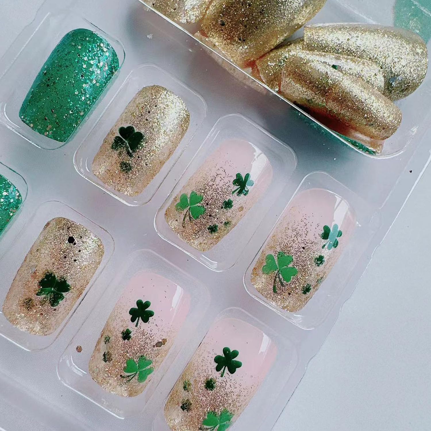 St. Patrick's Day Press On Nails - Medium Coffin Fake Nails with Lucky Clover Design, Green Gold Glitter & French Tips | 24Pcs Shamrock Glitter Full Cover Artificial Nails for Women | Perfect for Parties, Festivals & Irish Celebrations