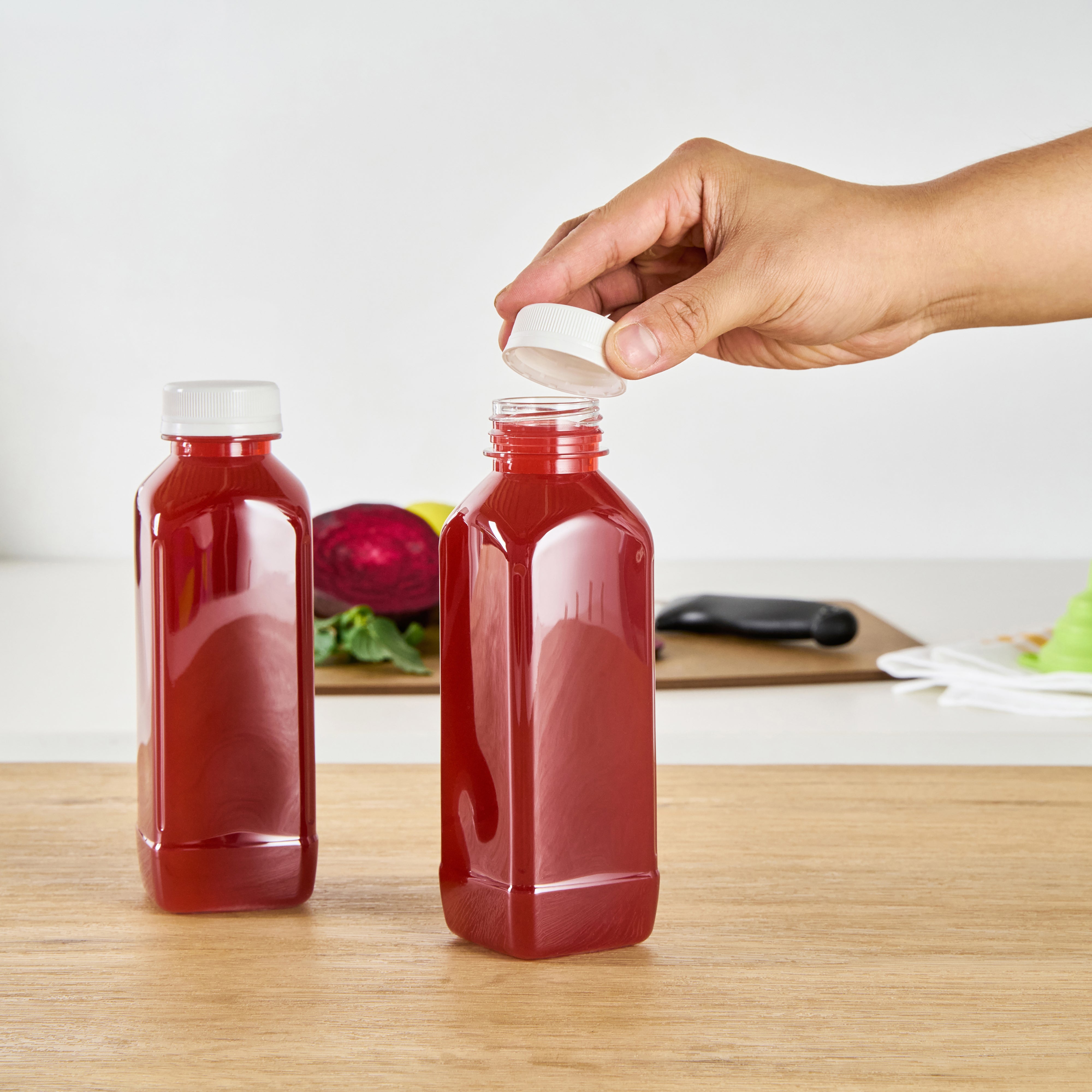 16 oz Square Clear Plastic Cold Pressed Juice Bottles with Safety Cap - 2.25