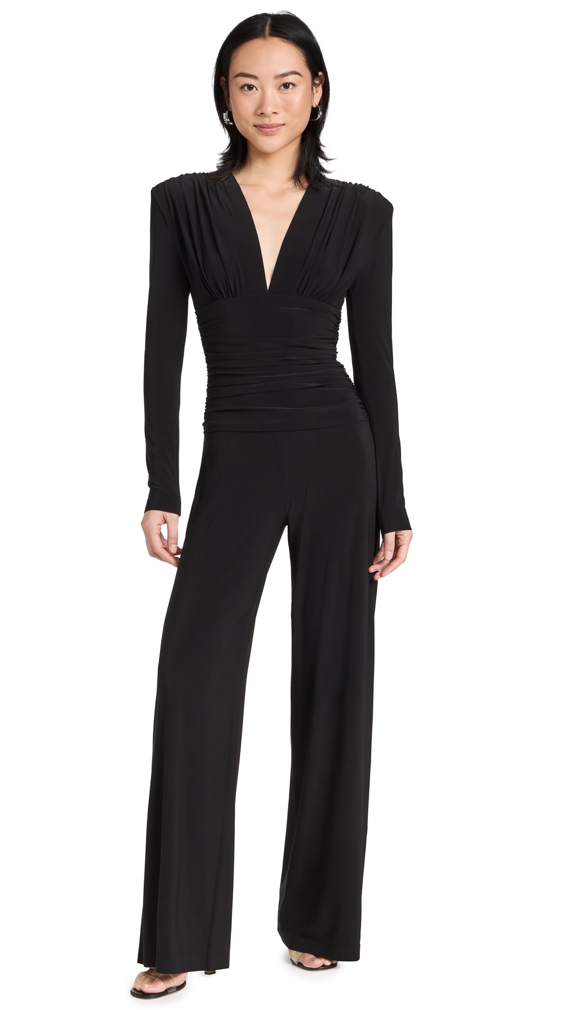 Norma Kamali Women's V-Neck Long Sleeve Shirred Waist Jumpsuit with Shoulder Pads | Elegant One-Piece Outfit for Work, Parties & Special Occasions