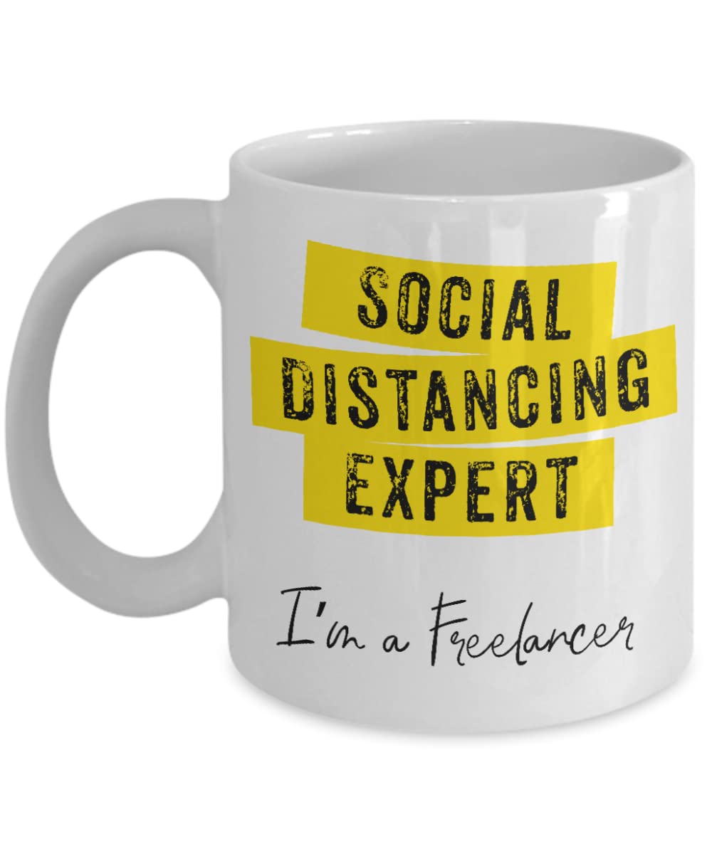 Funny Introvert Gifts - Work From Home Coffee Mug with 'Social Distancing Expert' Design - Perfect Stay at Home Gift for Remote Workers & Book Lovers - Great for Office, Home Office & Relaxing Coffee Breaks