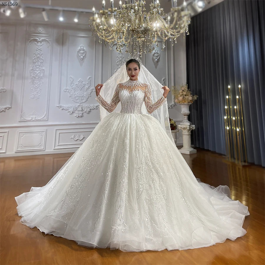 Elegant Beaded Ball Gown Wedding Dress with Long Sleeves - Perfect for Bridal Ceremonies, Formal Events & Romantic Photos