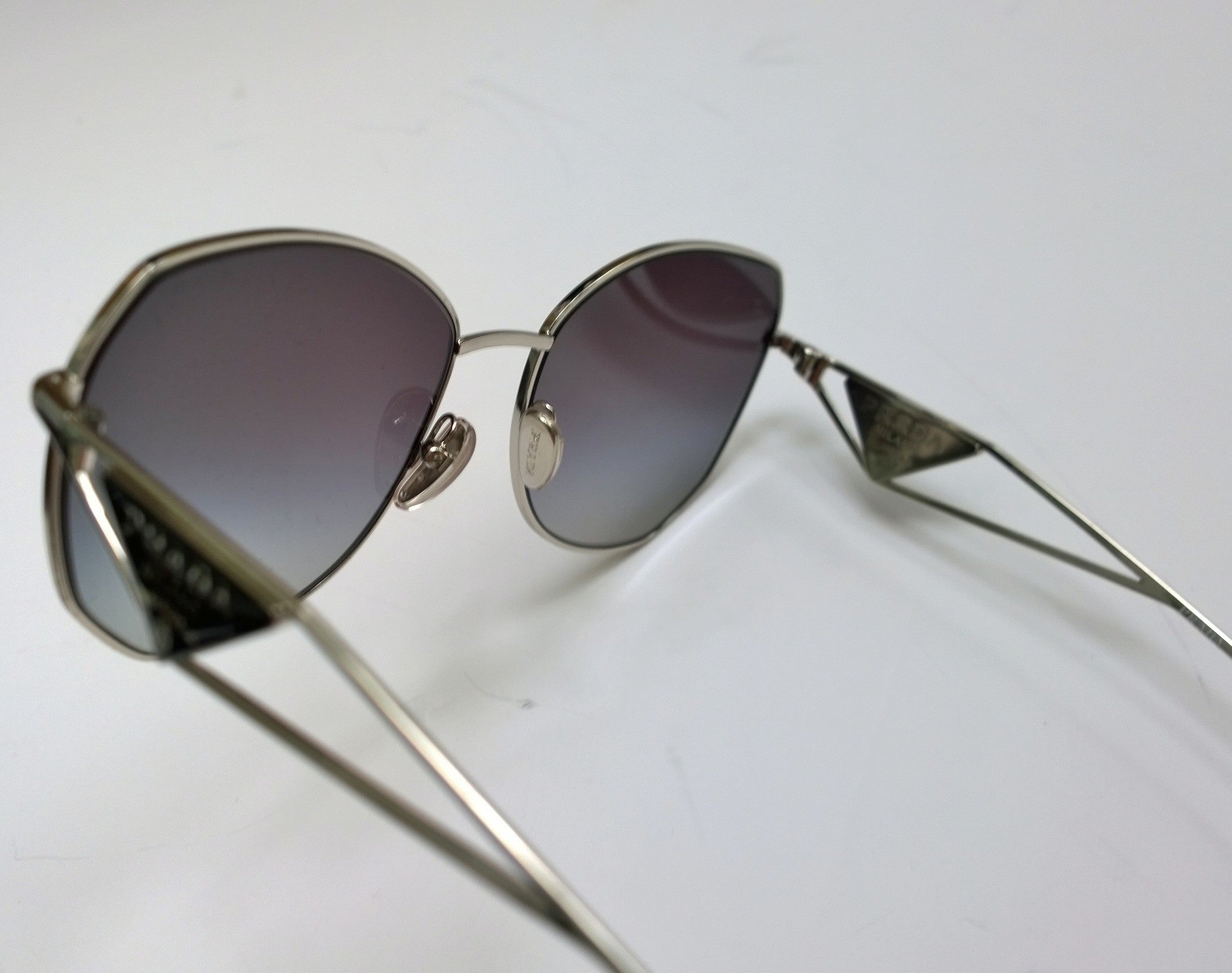 Prada Oversized Geometric Sunglasses for Women - Silver Frame with Triangle Logo Sides - UV Protection Fashion Sunglasses for Beach, Driving & Outdoor Activities