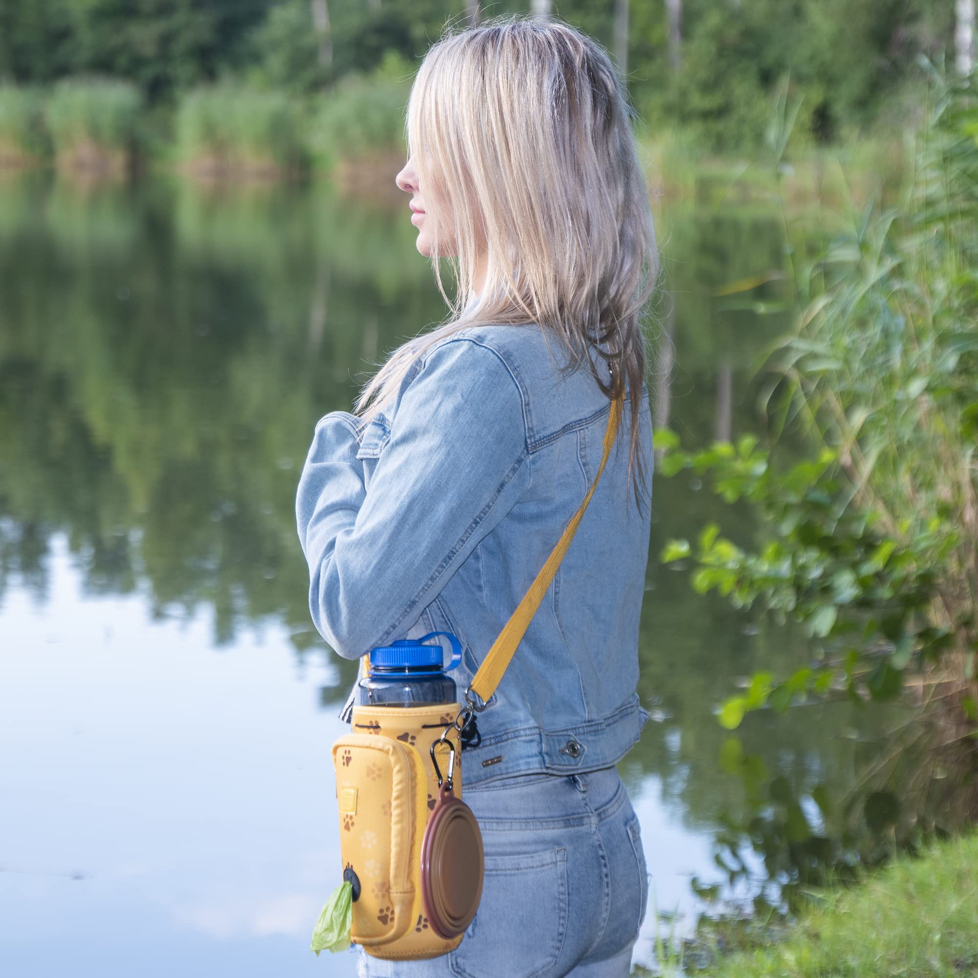 **Premium Adjustable Dog Water Bottle Carrier with Waste Bag Pocket & Padded Shoulder Strap - 40oz Large Capacity, Includes Collapsible Bowl (Yellow Paws & Hearts Design) - Perfect for Hiking, Dog Walks & Outdoor Adventures**
