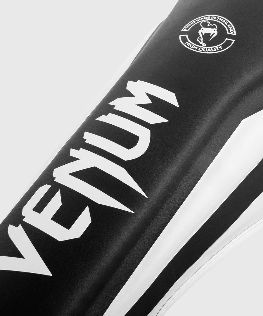 VENUM Elite Shin Guards - Black & White MMA Kickboxing Gear for Training & Competition - Perfect for Muay Thai, Kickboxing & MMA Fighters