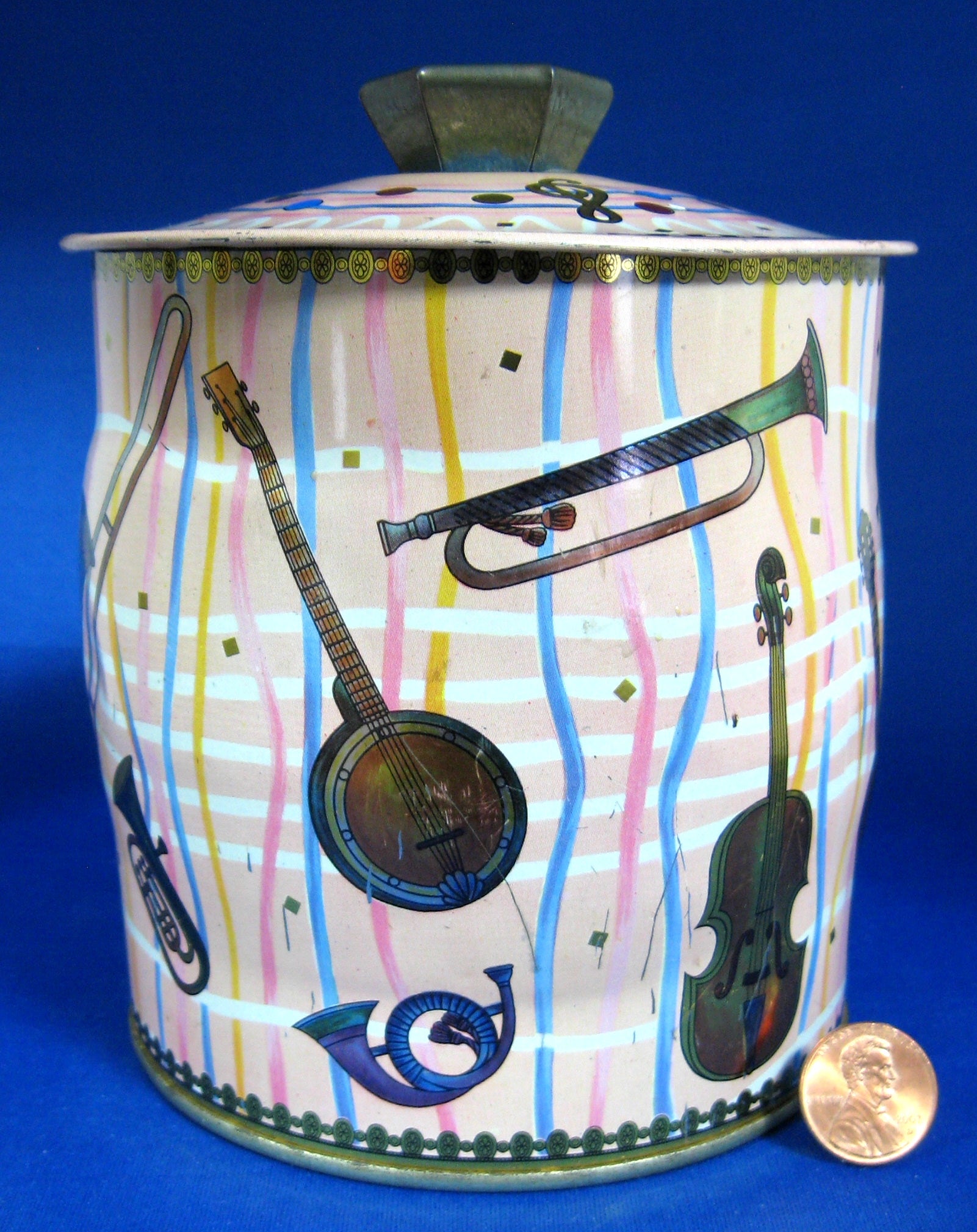 Vintage England 1940s Pink Tea Tin with Musical Instruments & Stripes Design - Perfect for Storing Biscuits, Cookies, or as Retro Home Decor