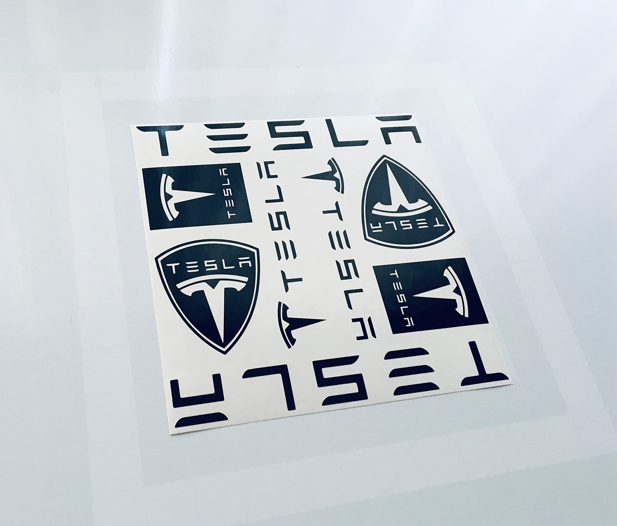 Premium Tesla Car Stickers Set of 8 - 8x8 Inch All Black Decals for Tesla Vehicles, Windows, Laptops, Tablets, Phones, Walls & Bumpers - Durable Vinyl Decorative Stickers for Car Enthusiasts & Home Decor