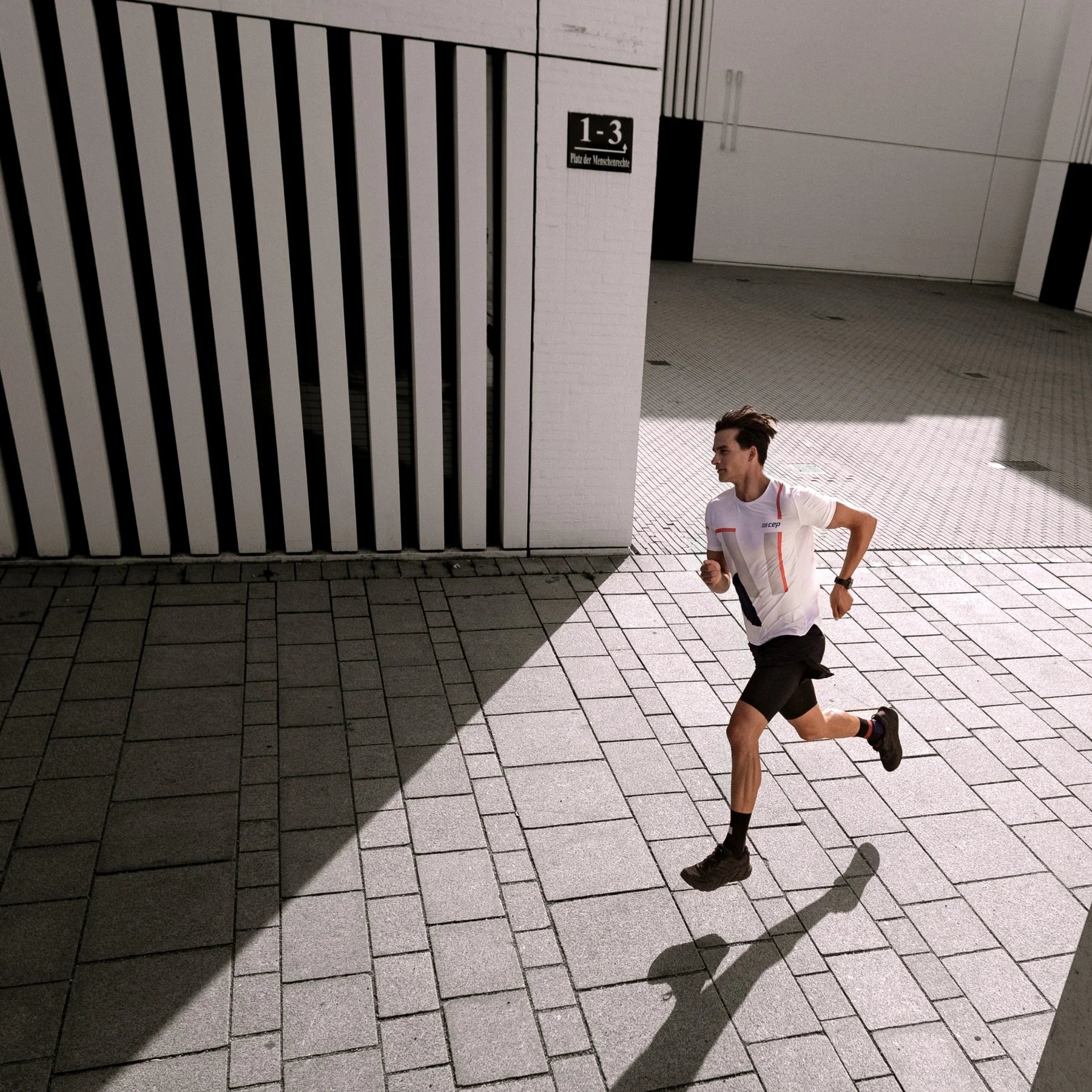 CEP Men's Performance Running Shirt - Moisture Wicking Round Neck Short Sleeve Athletic Top (White/Geometric Print) - Ideal for Jogging, Gym Workouts & Outdoor Sports