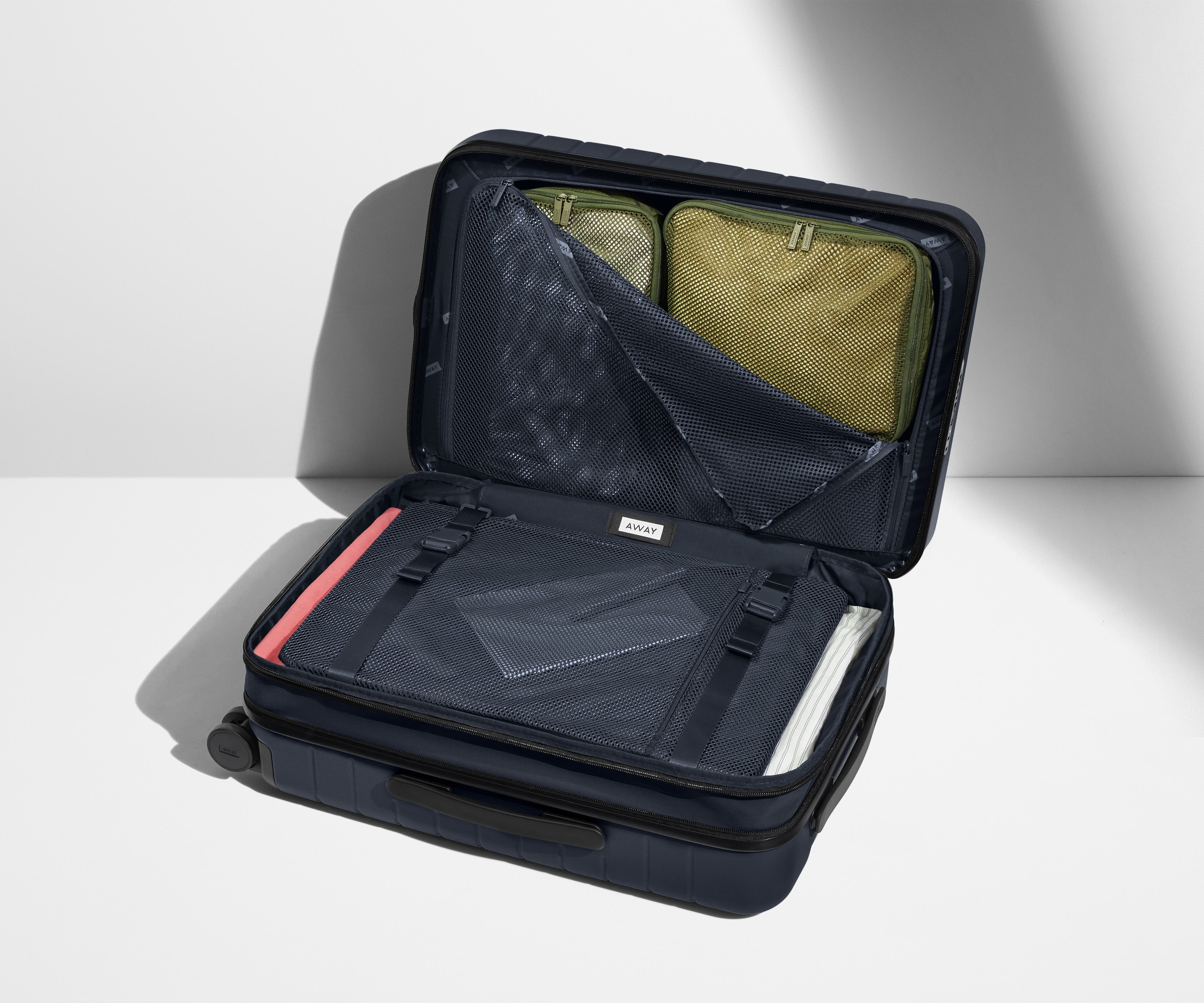 The Carry On Flex in Navy Blue - Lightweight Expandable Luggage for Travel - Perfect for Airplane, Business Trips & Weekend Getaways