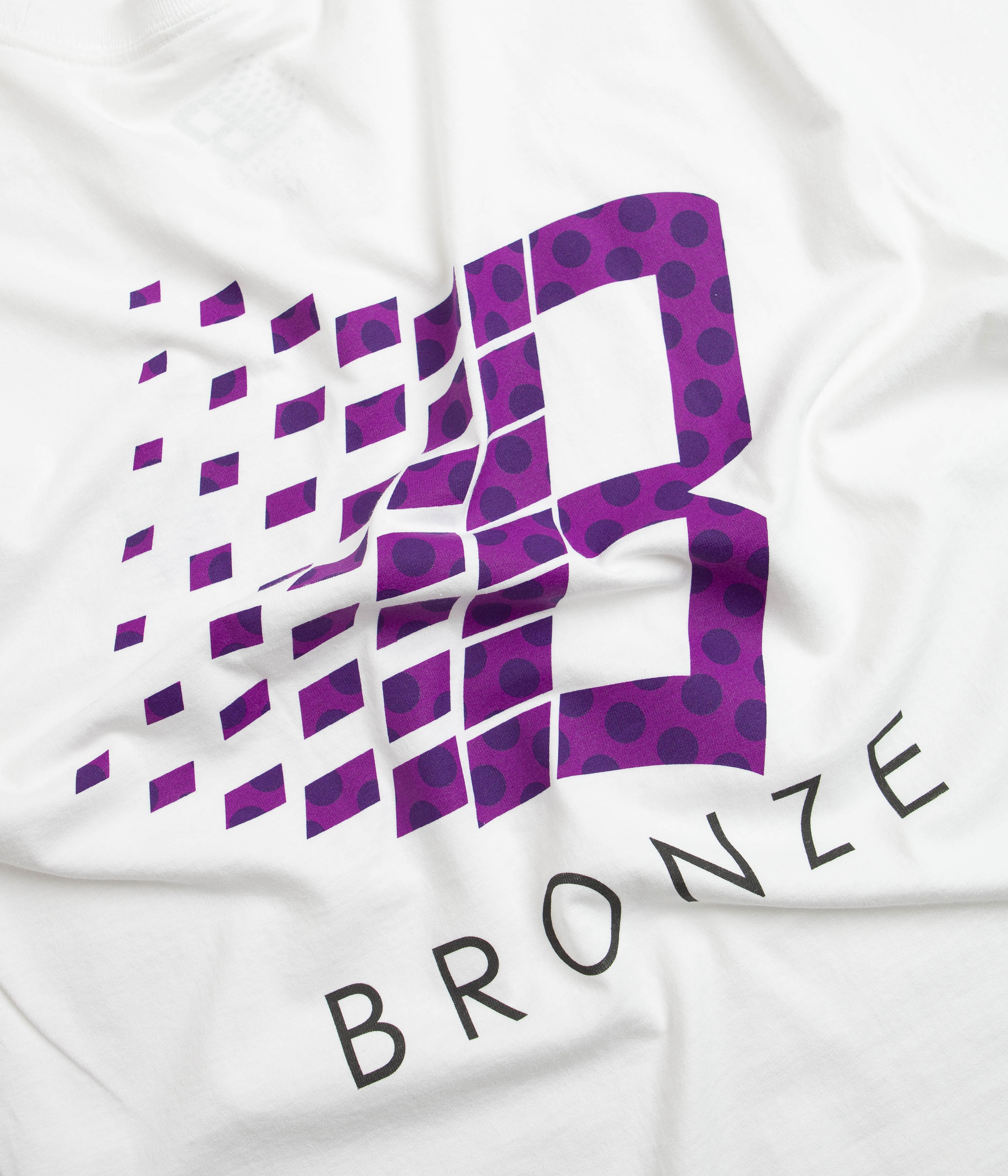 Bronze 56K Polka Dot Logo T-Shirt - White Cotton Graphic Tee for Men & Women | Casual Wear, Street Style, Music Festival Outfit