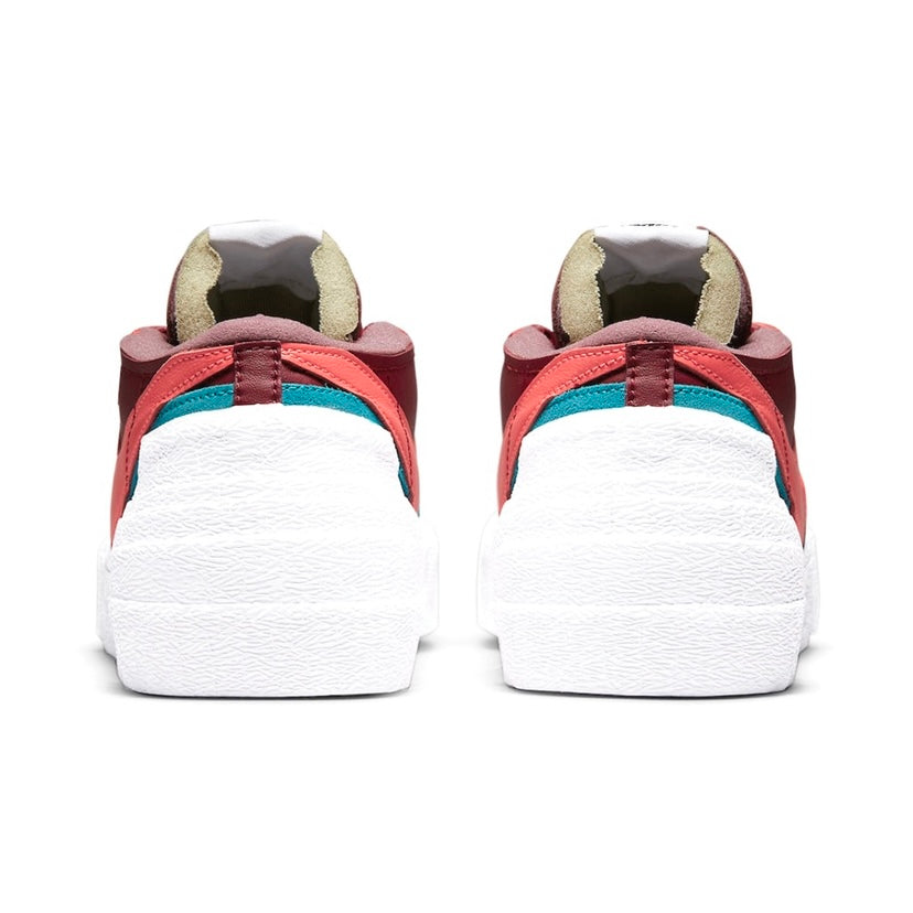 KAWS x Nike x Sacai Blazer Low Sneakers - Team Red/Hot Lava/White Colorway - Limited Edition Collaboration Shoes for Streetwear & Sneaker Collectors