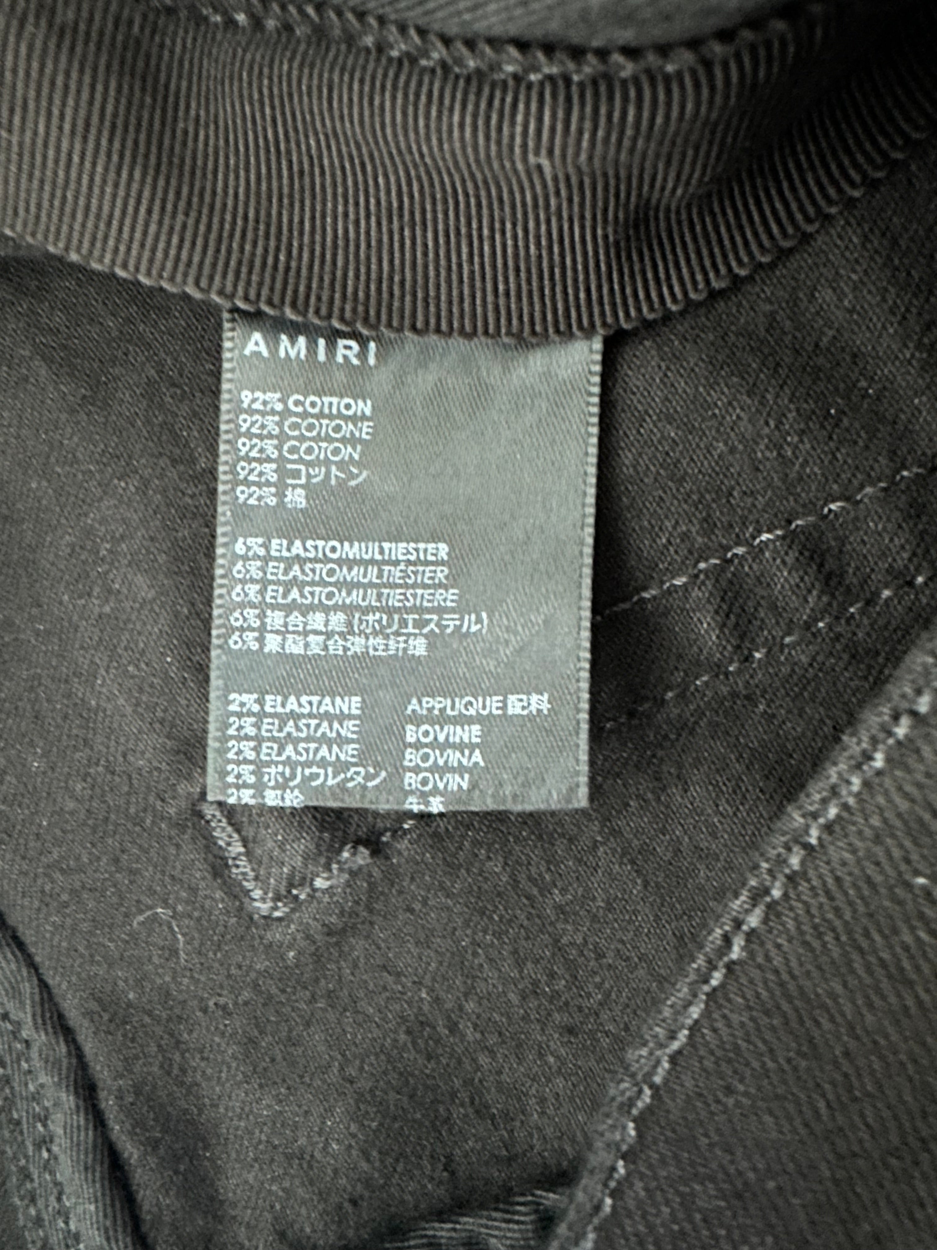 Amiri Aged Black & Blue Patch MX1 Jeans for Men - Distressed Denim Pants with Unique Patches | Perfect for Casual Wear, Street Style & Night Out
